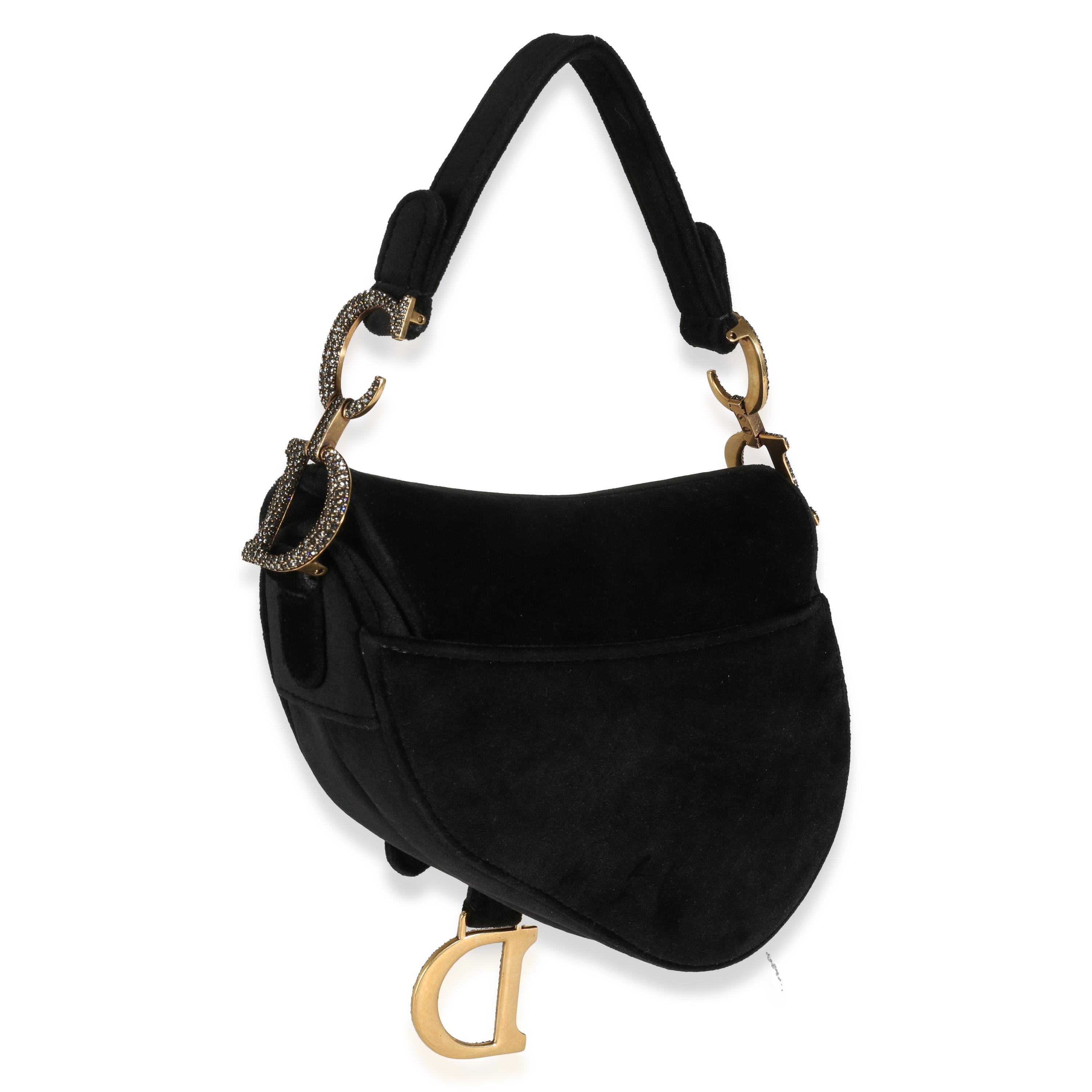 Listing Title: Christian Dior Black Velvet Crystal Mini Saddle Bag
SKU: 142637
Condition: Pre-owned 
Condition Description: Designed by John Galliano in 1999, Dior's saddle bag made its debut on the SS00 runway. The cowboy-inspired accessory has