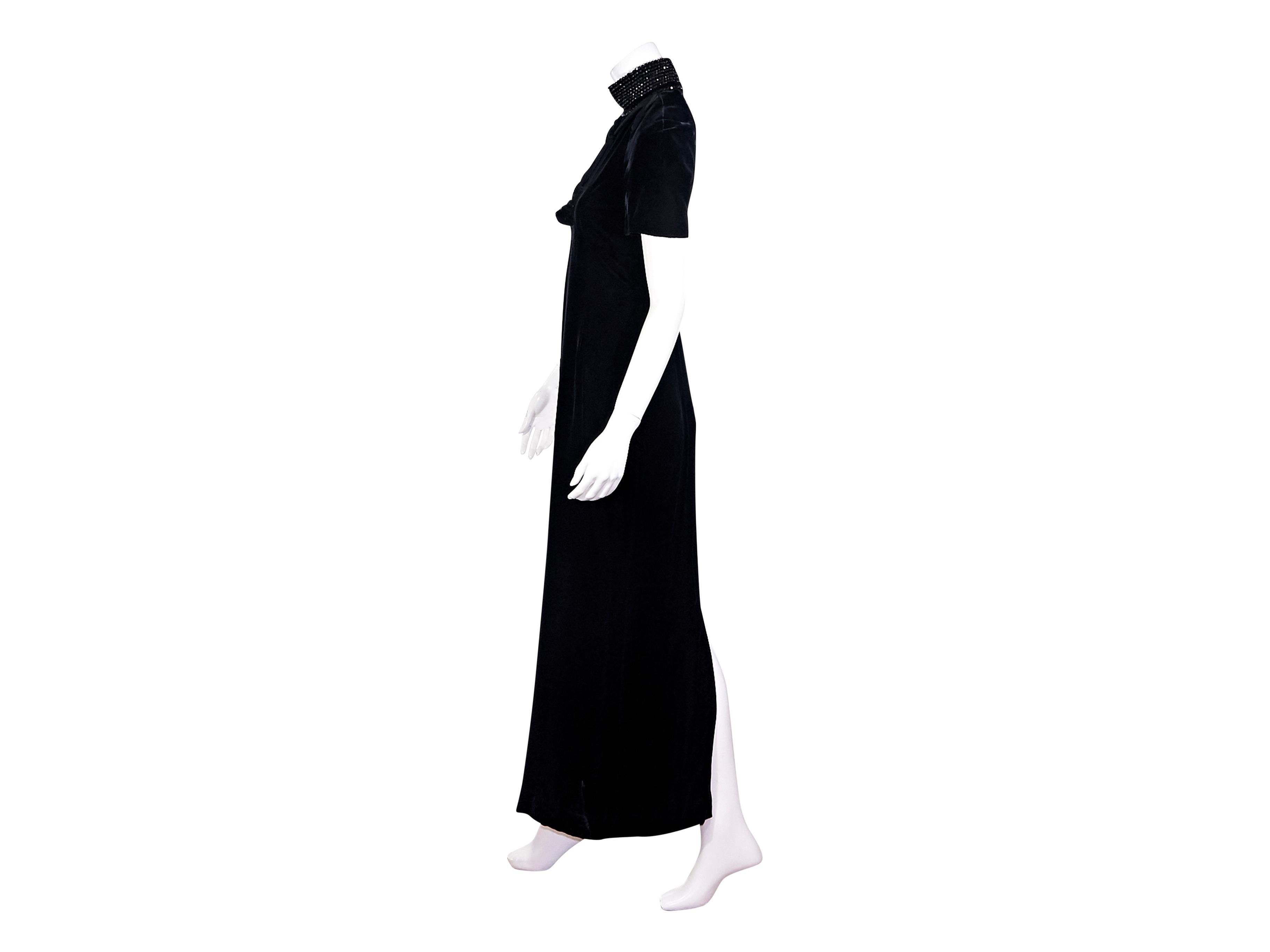 Product details: black velvet demi-couture maxi dress by Christian Dior.  Circa the 1990s.  Embellished mock neck with tassels.  Short sleeves.  Concealed back zip closure.  Back center hem slit.  Label size FR 38.  30