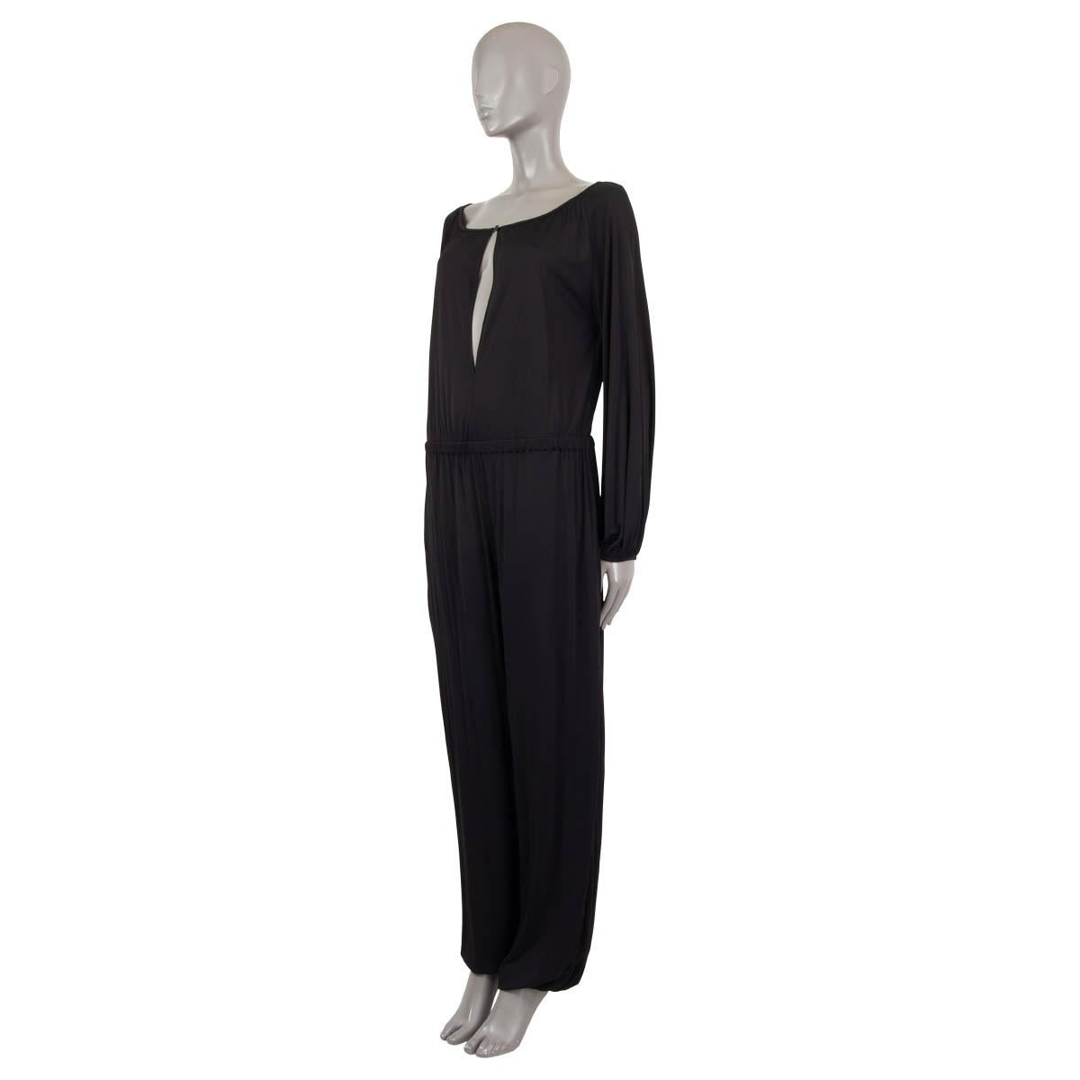 100% authentic Christian Dior keyhole jumpsuit in black viscose (100% - please note the content tag is missing). Features an elastic waist and cuffs. Closes with a button on the neck. Unlined. Has been worn and is in excellent condition.

2019