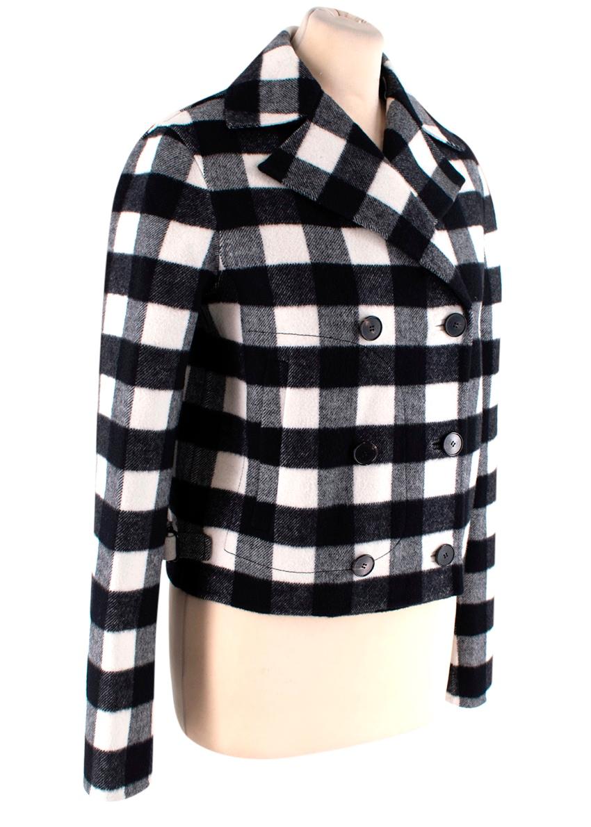 Christian Dior Black & White Checked Wool Cropped Jacket
 

 - Retro inspired, black & white wool check cropped jacket with double-breasted closure and notched wide lapels 
 - Inset front pockets, vented back and hemline toggles 
 

 Materials 
