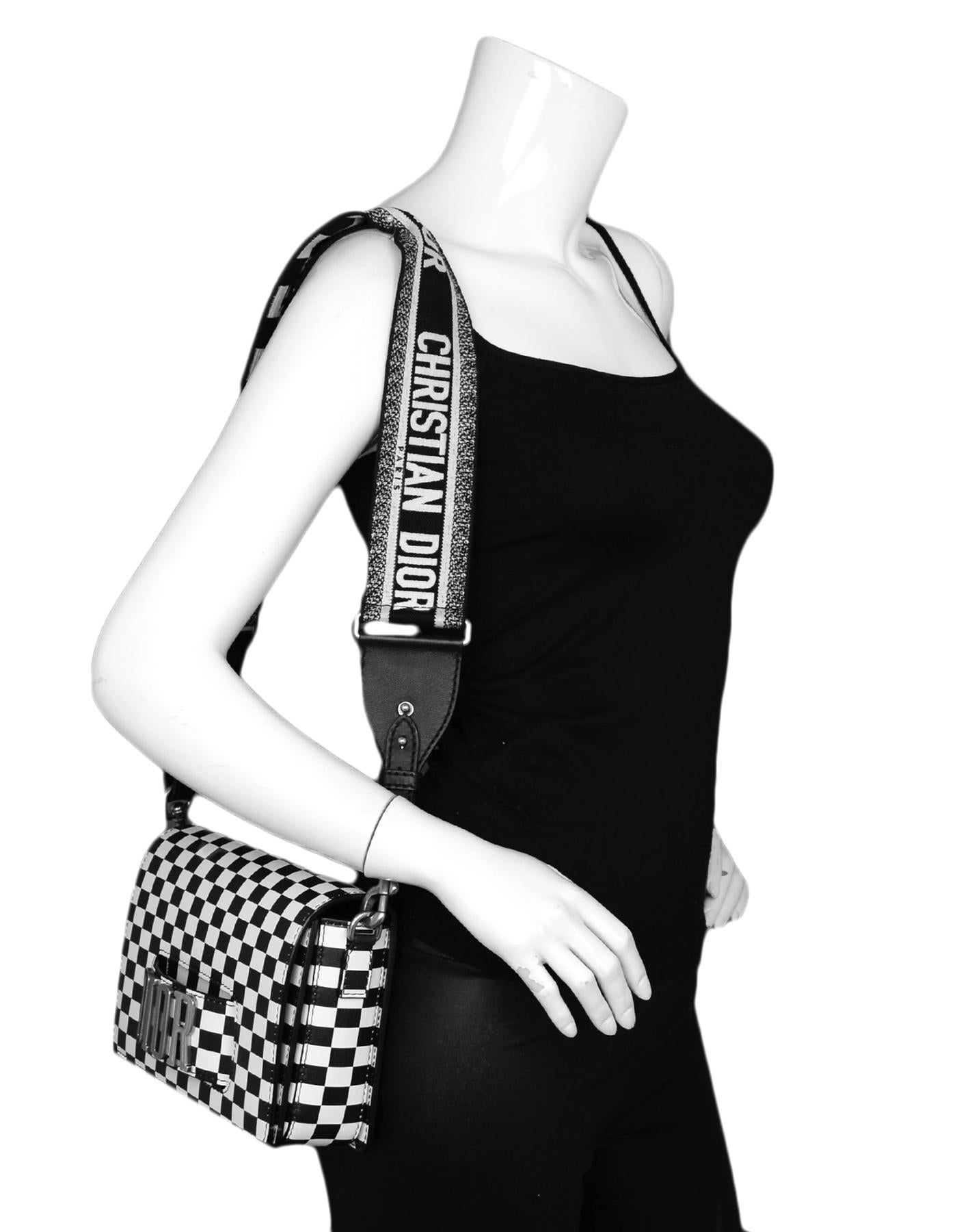 Christian Dior Black/White Checkered Smooth Calfskin Dio(r)evolution Flap Bag

Made In: Italy
Year of Production: 2018
Color: Black, white
Hardware: Silvertone hardware
Materials: Calfskin leather, canvas strap
Lining: Black suede