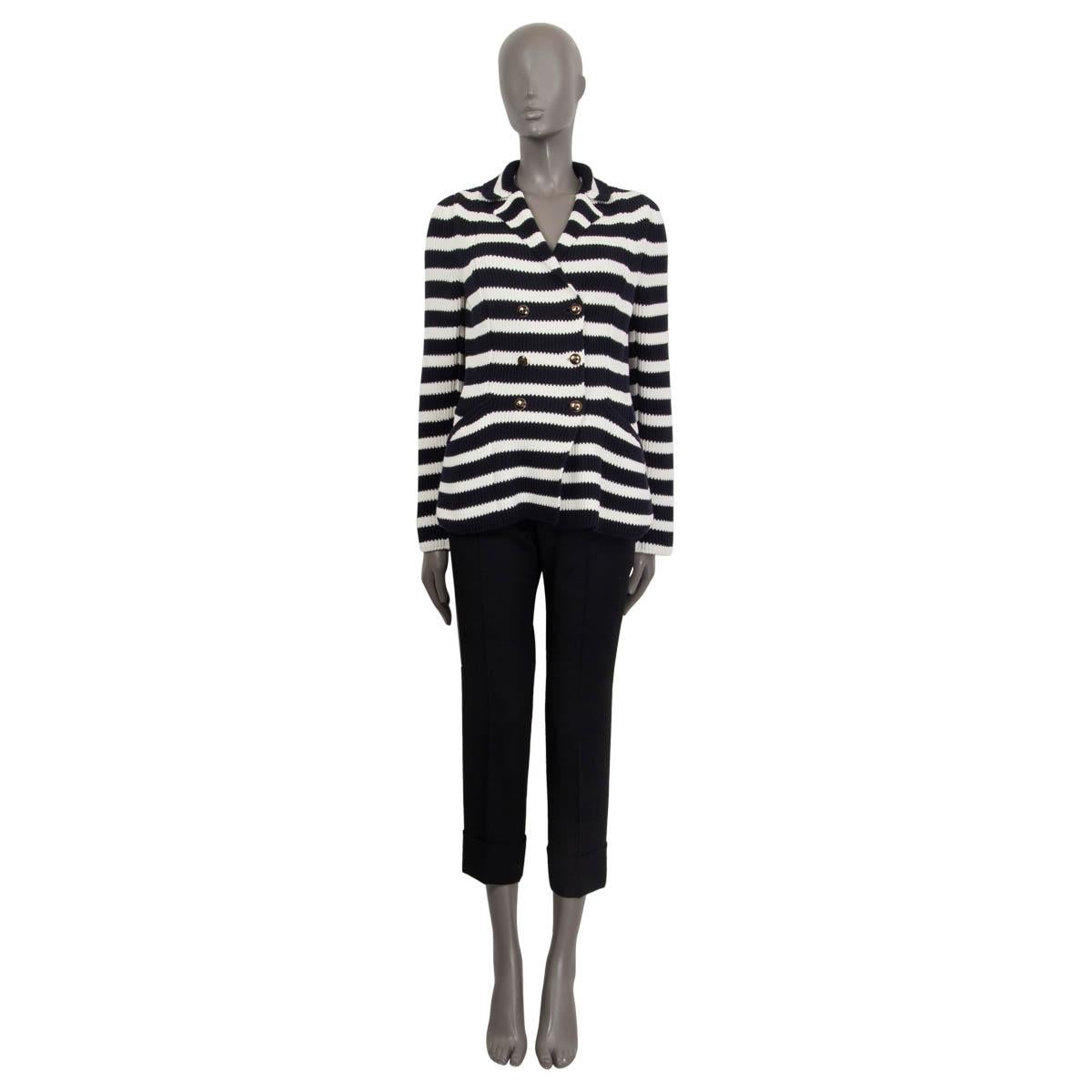 100% authentic Christian Dior 2021 knit bar jacket in black and white cotton (100%). Features buttoned cuffs and two welt pockets on the front. Has a tailored collar and a double-breasted front with ‘CD’ signature buttons. Unlined. Has been worn and
