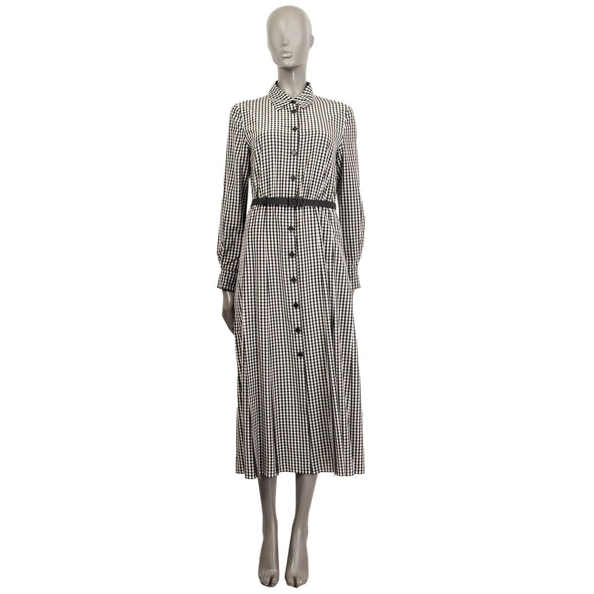 100% authentic Christian Dior shirt dress in black and white silk (100%) with gingham print. Comes with a CD-logo leather belt, long sleeves with one button cuffs and a slip-dress in black silk (100%). Has been worn and is in excellent