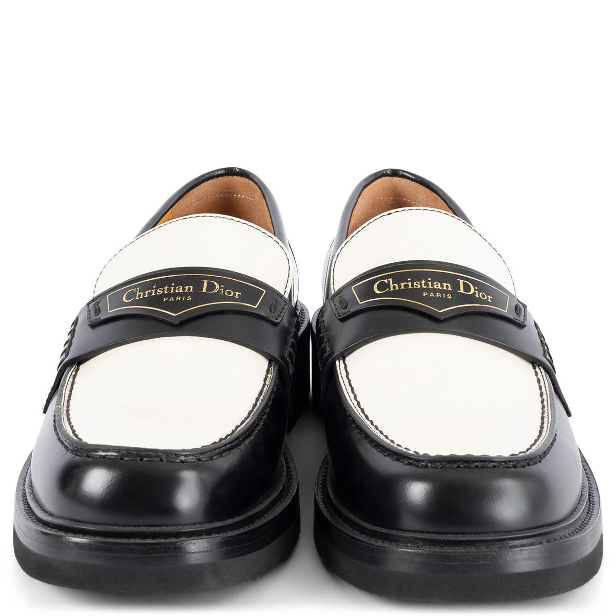 100% authentic Christian Dior Boy loafers in black & white calfskin featuring gold-tone 'Christian Dior PARIS' signature on a leather tag in the front and a black rubber sole. Brand new.

Measurements
Model	KDB759ACA_S11X
Imprinted Size	38.5
Shoe