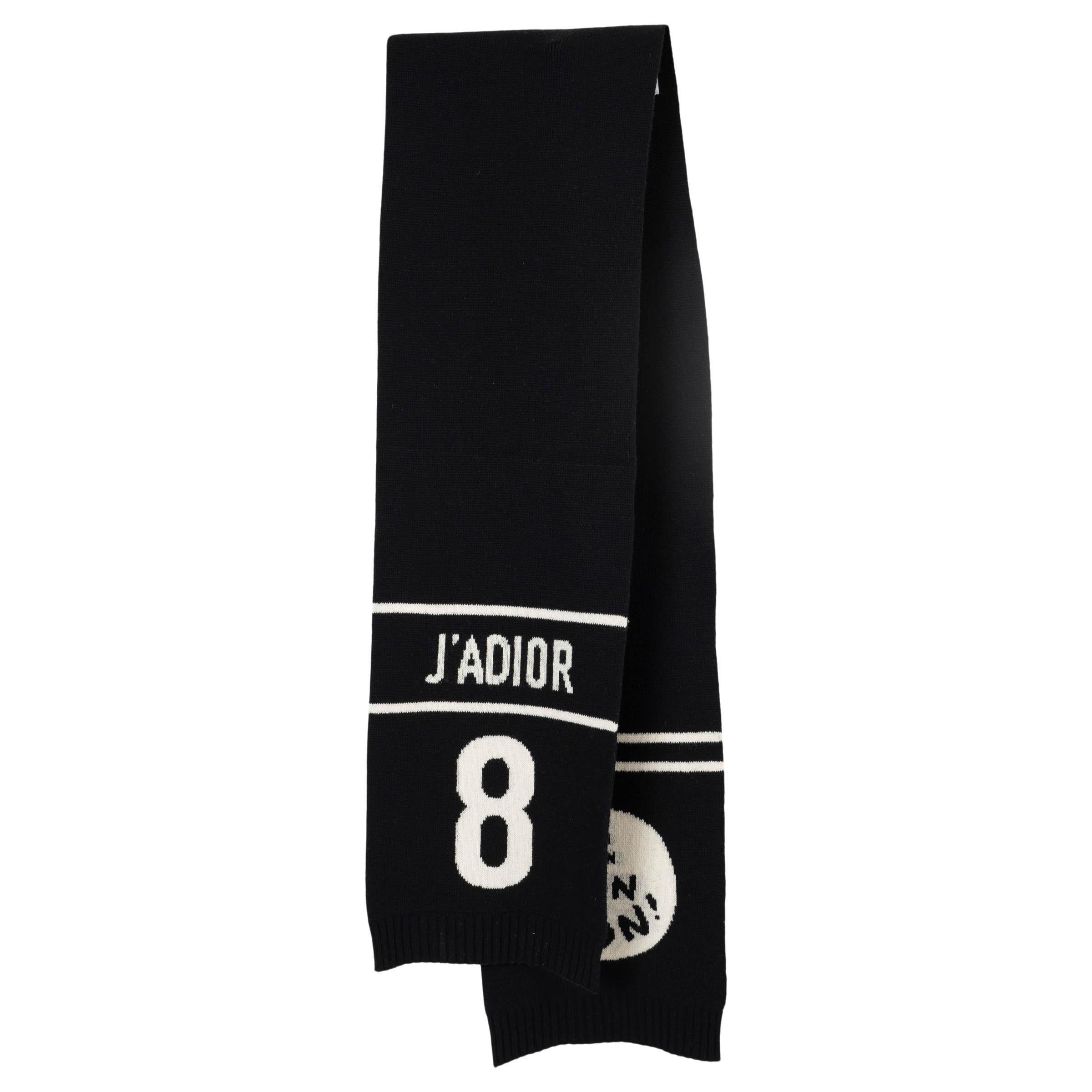 This 100% authentic Christian Dior J'Adior 8 Non Non Non knitted muffler is crafted from a luxurious blend of black and white wool (70%) and cashmere (30%), offering both warmth and softness. The design features the bold J'Adior 8 Non Non Non motif