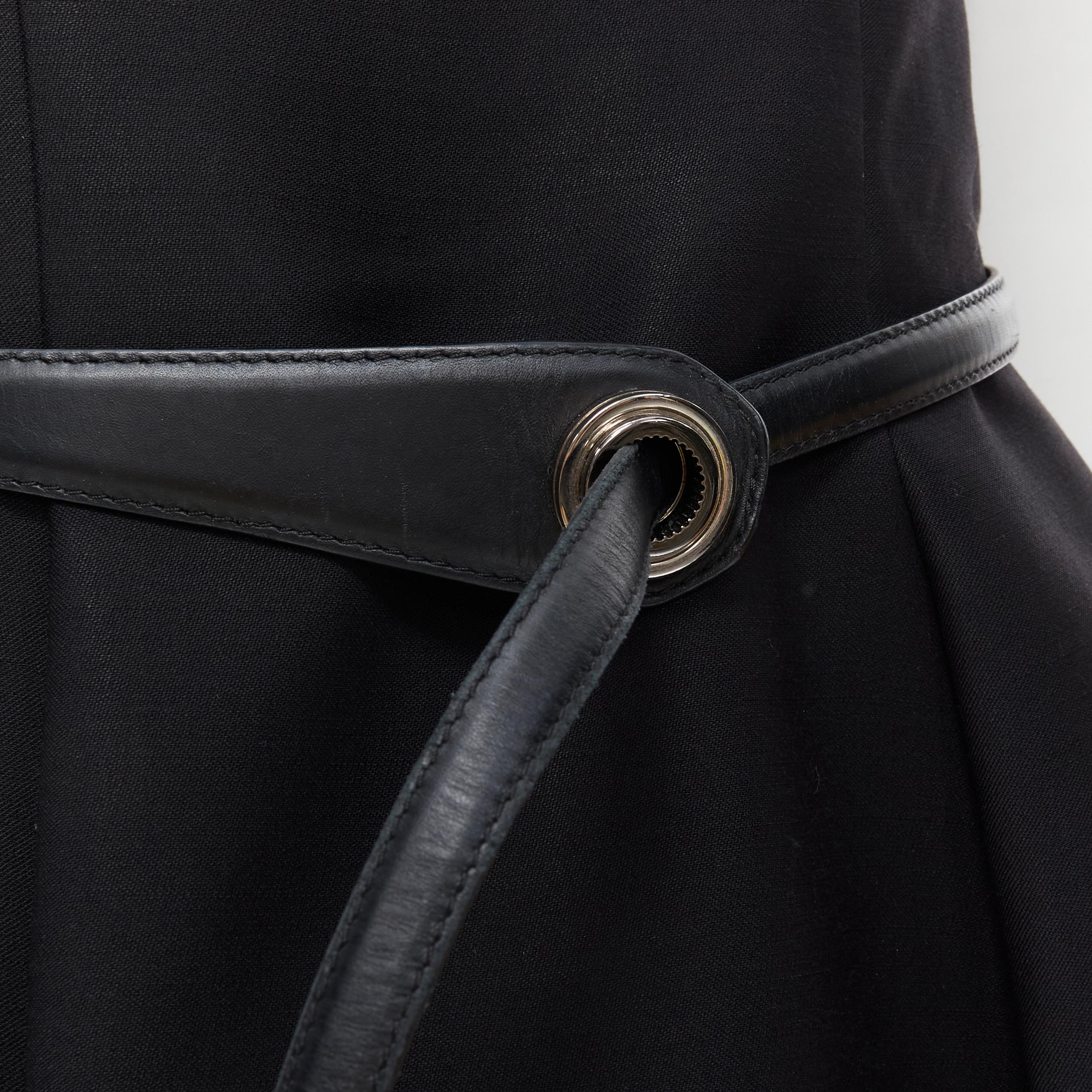 CHRISTIAN DIOR black wool pinched seam leather belt fit flare dress FR36 S 
Reference: TGAS/B01995 
Brand: Christian Dior 
Material: Wool 
Color: Black 
Pattern: Solid 
Closure: Zip 
Extra Detail: Short sleeves. Pinched seams. Fitted waist. Flared