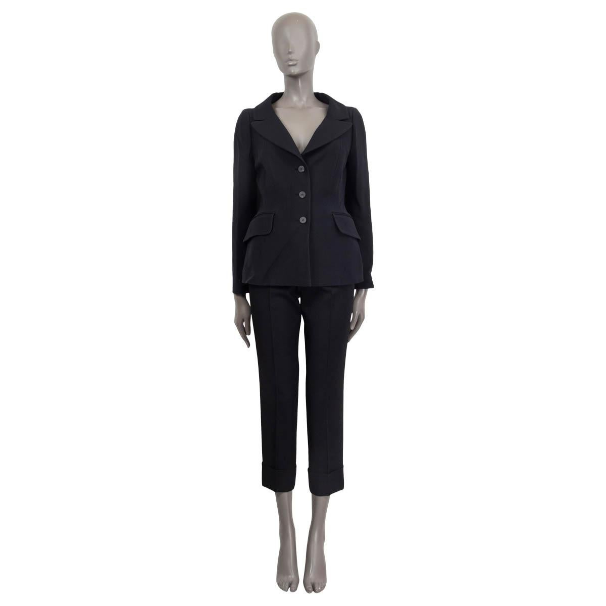 100% authentic Christian Dior classic blazer in black wool (77%) and silk (23%). Features portrait collar, two sewn shut flap pockets and buttoned cuffs. Opens with three buttons. Lined in black silk (100%). Has been worn and is in excellent