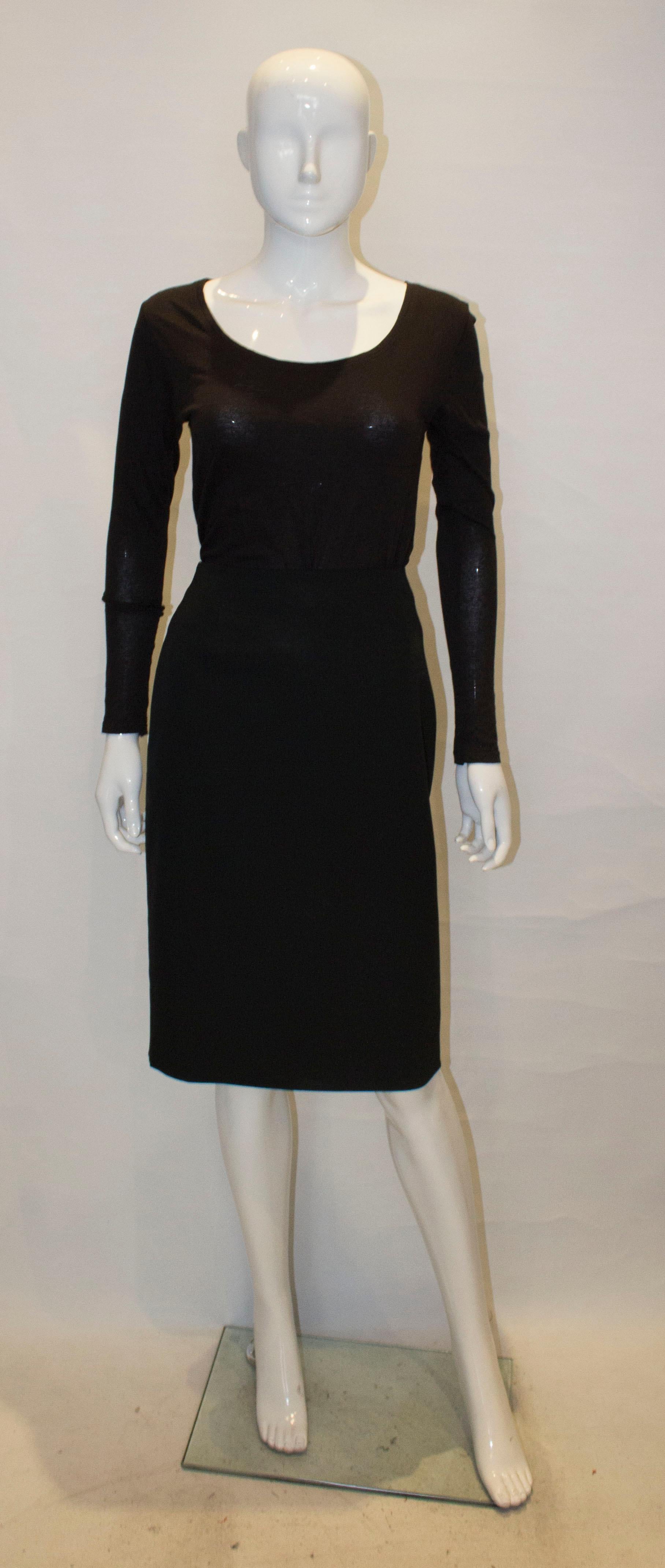 A chic black wool skirt by Christian Dior , UK size 10.
The skirt is lined in silk , with an invisible zip opening and slit at the back.
