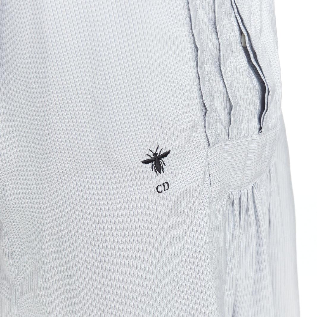 CHRISTIAN DIOR blue 100% silk CD bee embroidery button down shirt dress FR36 S
Reference: GEGG/A00076
Brand: Dior
Designer: Maria Grazia Chiuri
Material: Silk
Color: Blue, Black
Pattern: Striped
Closure: Button
Extra Details: Christian Dior