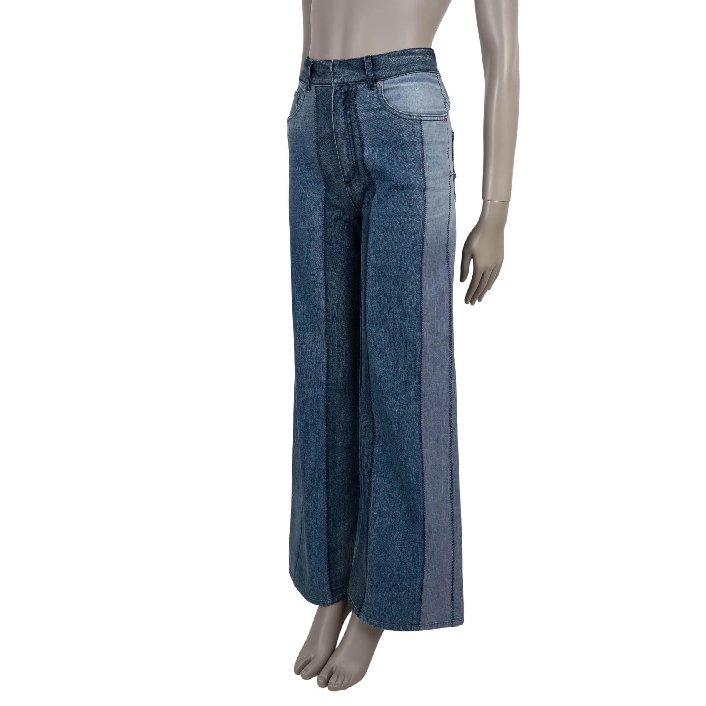 Christian Dior jeans in various shades of blue patchwork striped denim cotton (100%). Feature a high-waisted silhouette with wide legs and classic five-pocket design. Closes with a concealed button and zipper on the front. A striking