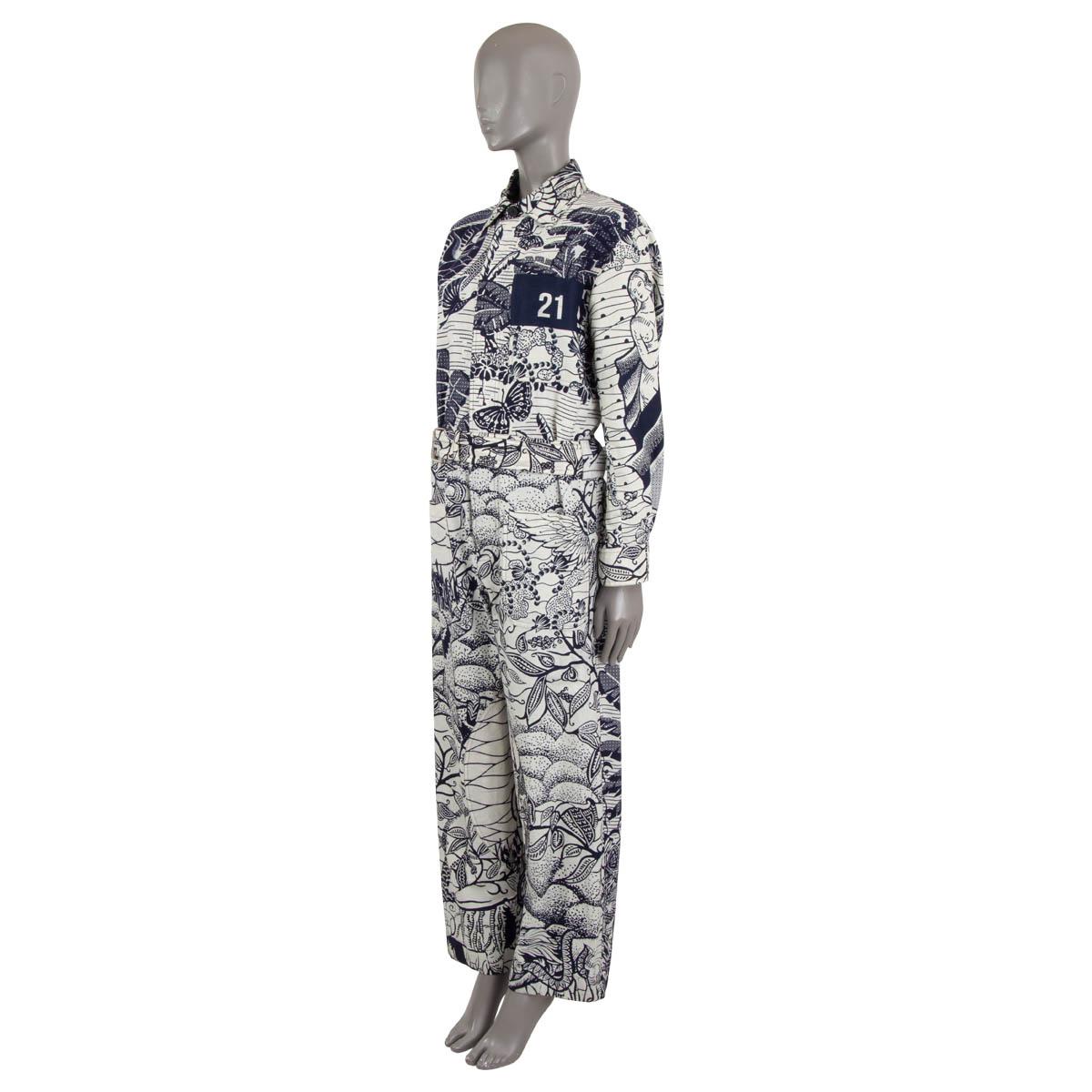 100% authentic Christian Dior belted jumpsuit in navy blue and off-white cotton (100%) with Toile de Jouy Tropicalia print. Features a chest pocket, two patch pockets and a relaxed fit. Closes with buttons on the front and is unlined. Has been worn