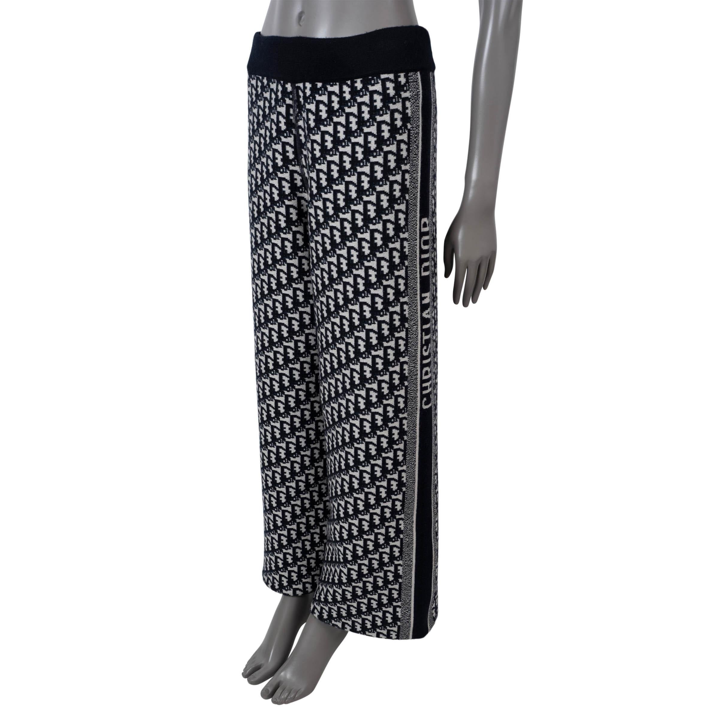 100% authentic Christian Dior reversible pants in midnight blue double sided cashmere (97%), nylon (2%) and elastane (1%) - please note the content tag is missing. Features a logo side stripes, elastic waist and wide legs. Solid blue on one side and