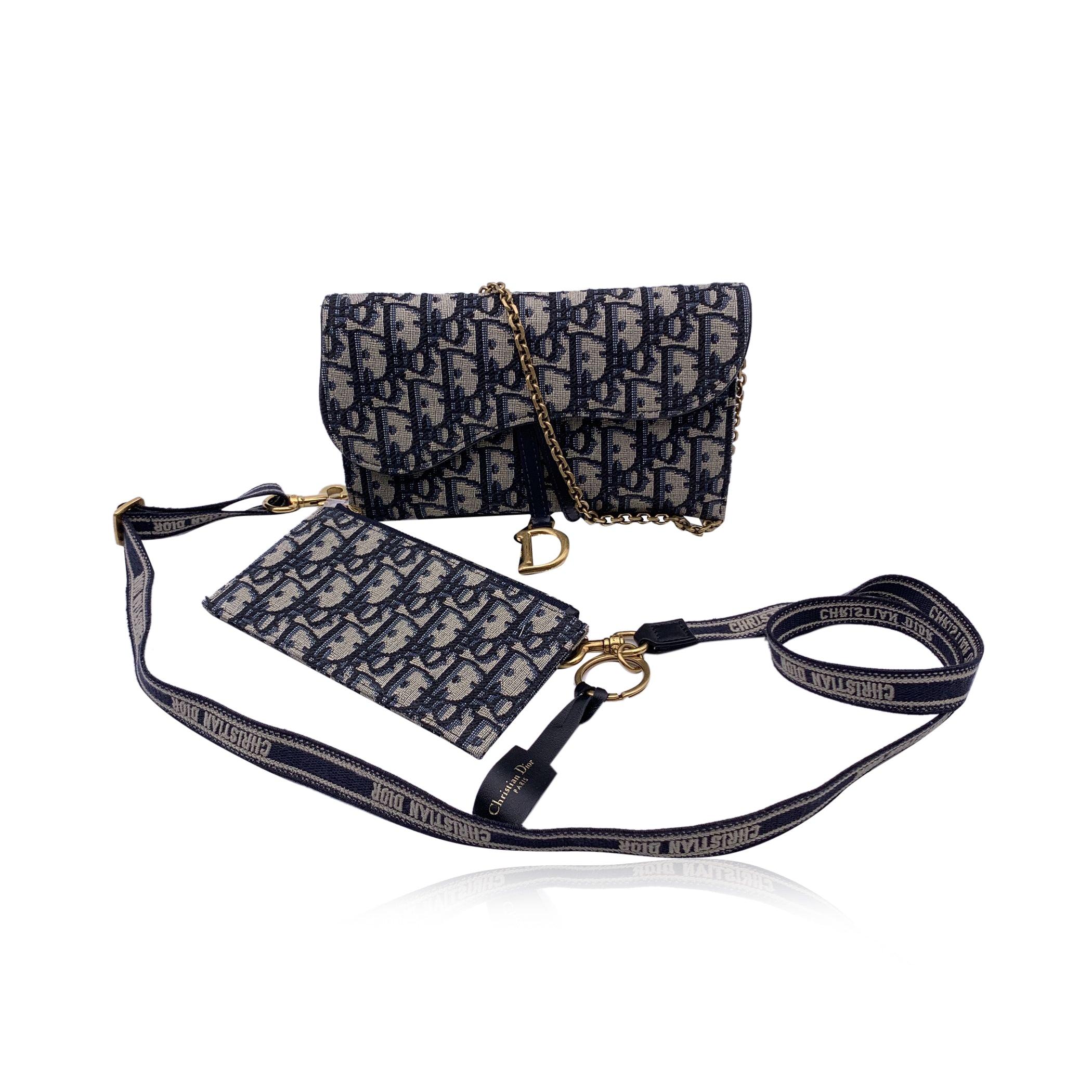 This beautiful Bag will come with a Certificate of Authenticity provided by Entrupy. The certificate will be provided at no further cost. Gorgeous CHRISTIAN DIOR Saddle WOC Wallet on chain, made of blue Dior Oblique jacquard canvas. Saddle flap is