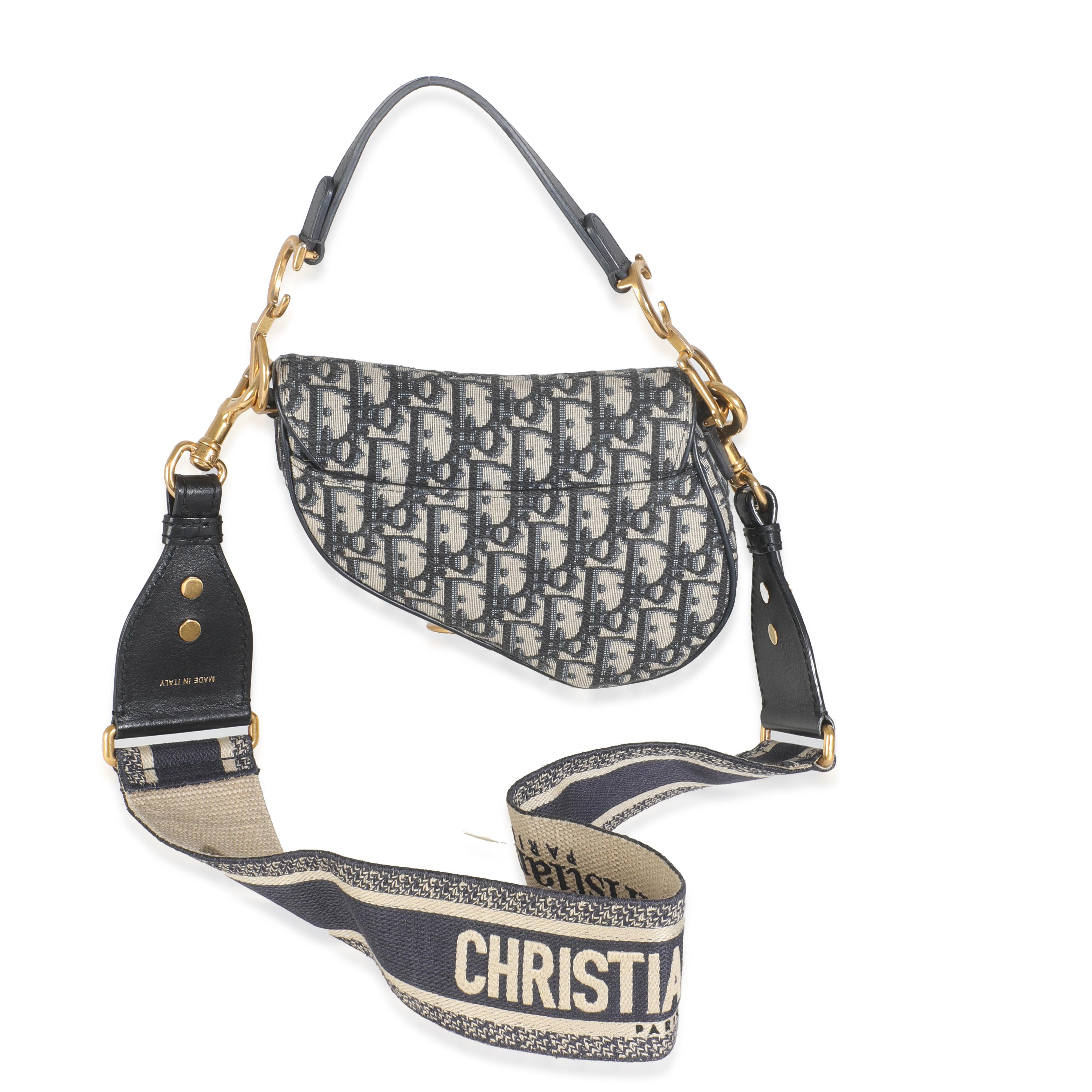 Listing Title: Christian Dior Blue Jacquard Oblique Mini Saddle Bag
SKU: Z145584
Condition: Pre-owned 
Condition Description: Designed by John Galliano in 1999, Dior's saddle bag made its debut on the SS00 runway. The cowboy-inspired accessory has