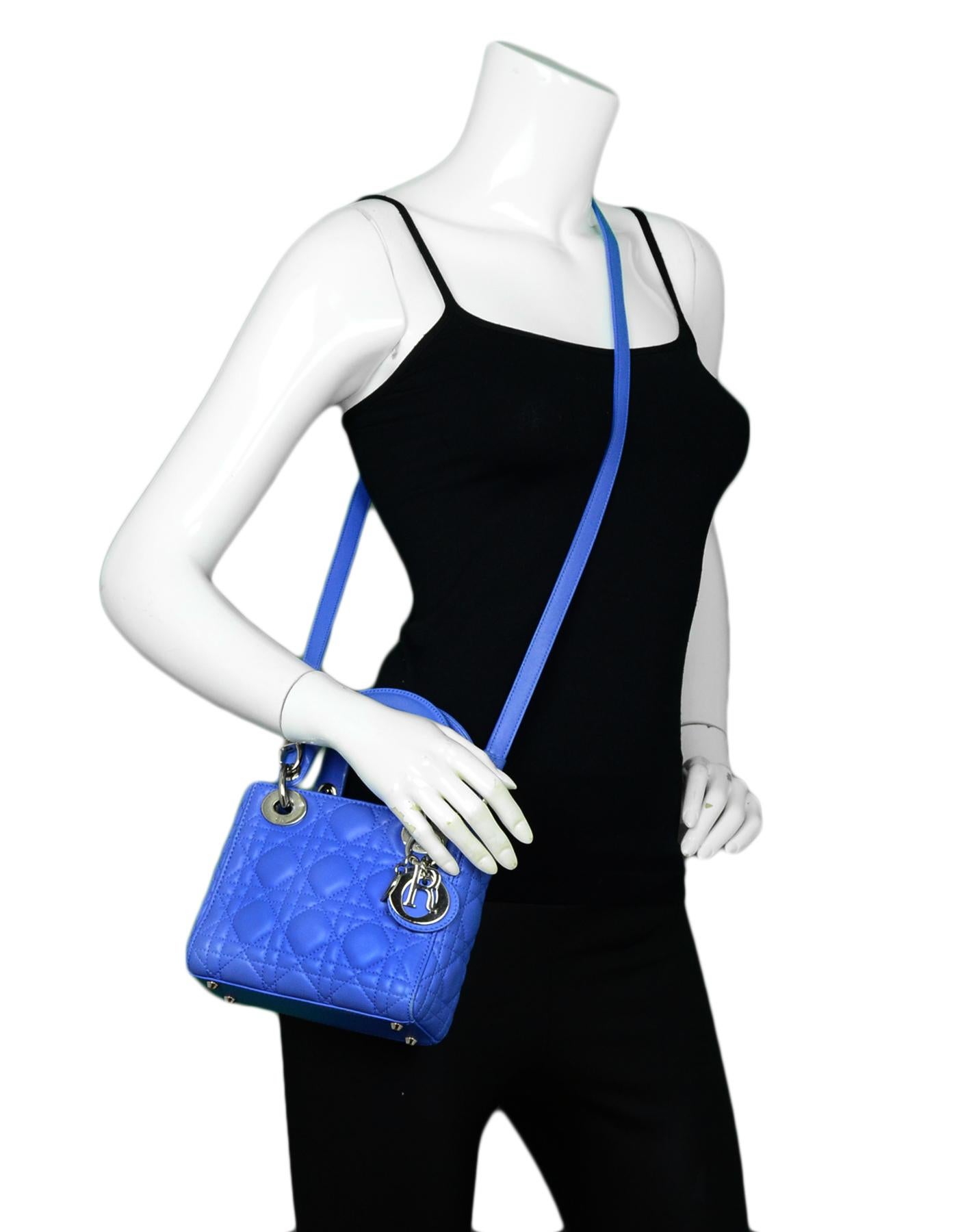 Christian Dior Blue Lambskin Leather Cannage Quilted Mini Lady Dior Crossbody Bag

Made In: Italy
Color: Blue
Hardware: Silvertone
Materials: Lambskin Leather
Lining: Fine textile 
Closure/Opening: Open top
Exterior Pockets: None
Interior Pockets: