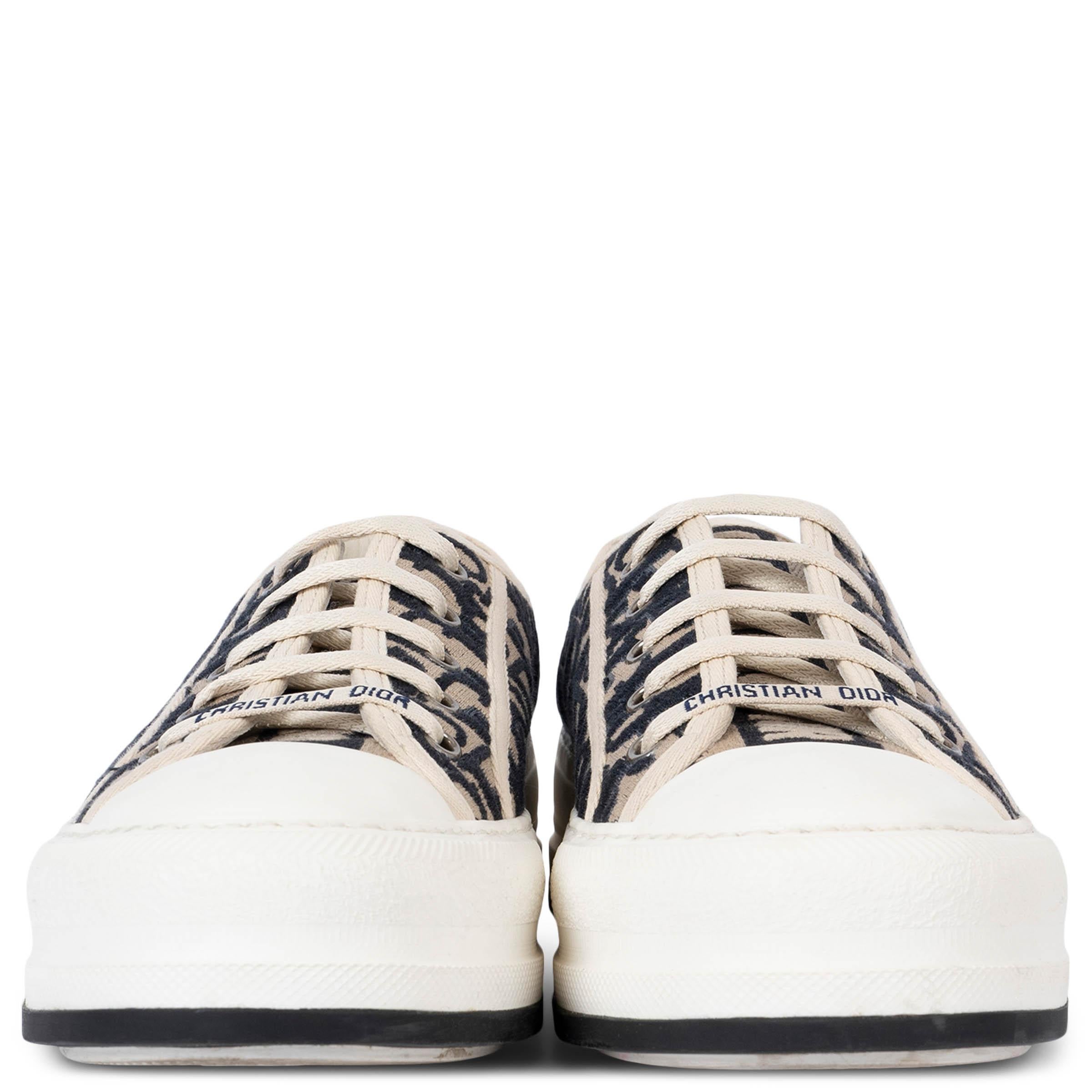 100% authentic Christian Dior Walk'n'Dior platform sneakers in deep blue and ecru Oblique canvas with blue and ecru embroidered tongue, Christian Dior laces and chunky white rubber sole. Have been worn and are in excellent condition.