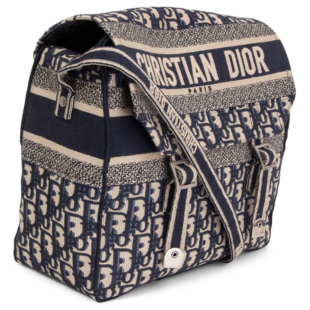 100% authentic Christian Dior Diorcamp Oblique Embroidery Bag in beige canvas embroidered with the blue Dior Oblique motif, and is enhanced by a 'CHRISTIAN DIOR' signature across the front. Featuring an adjustable shoulder strap, the messenger bag
