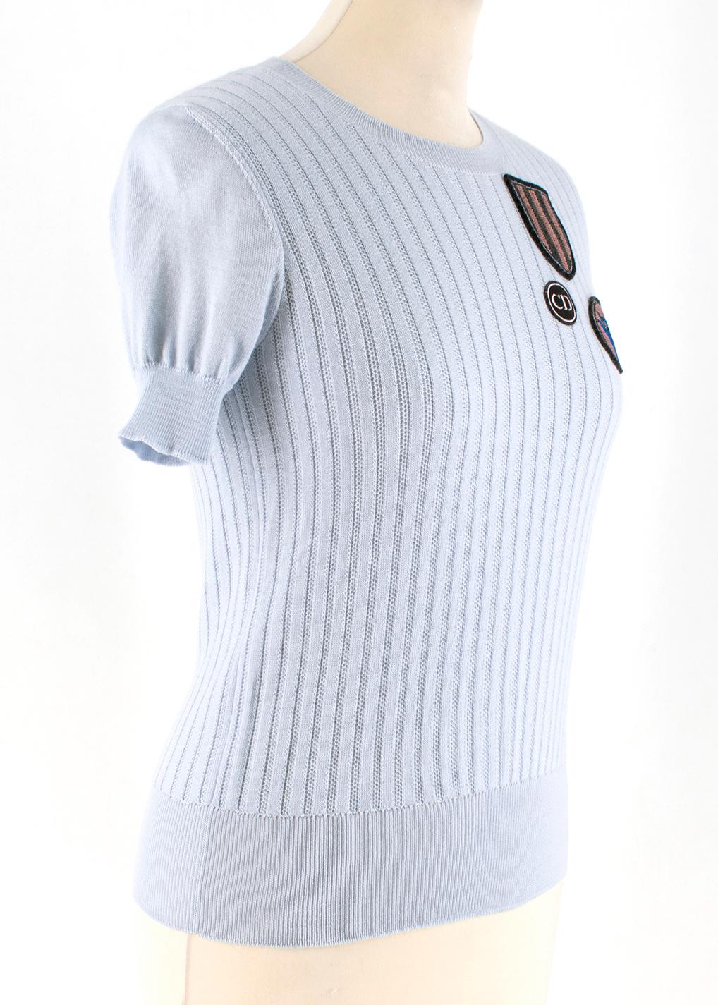  Christian Dior Blue Ribbed Knit T-Shirt

- Cashmere, wool and silk blend
- Short, ribbed sleeves
-Round neck
- Sequinned patches in upper right corner 

Please note, these items are pre-owned and may show some signs of storage, even when unworn and