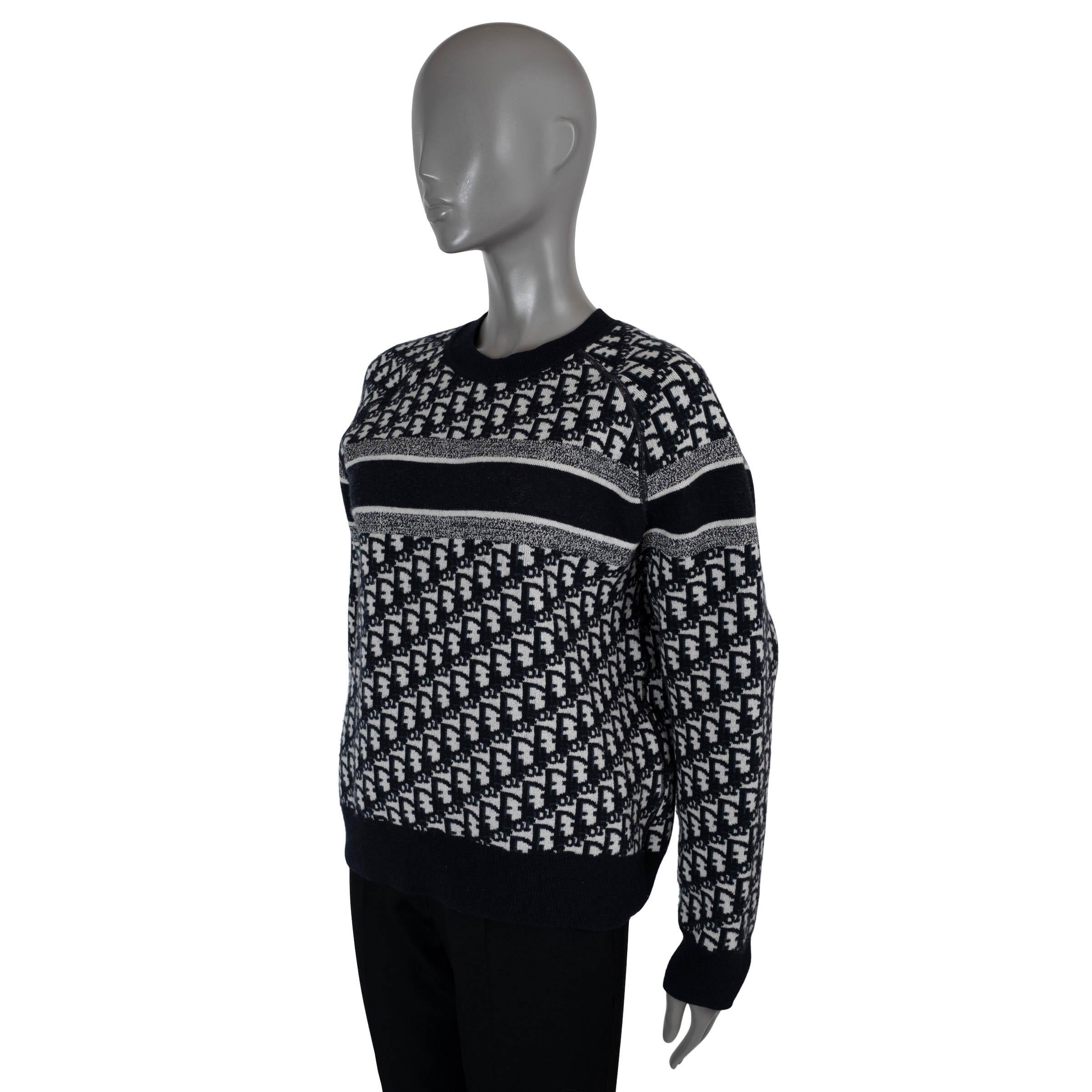 100% authentic Christian Dior reversible sweater in midnight blue and white double sided cashmere (97%), nylon (2%) and elastane (1%). Features a relaxed silhouette, crewneck, rib-knit trim, logo adorns the back of the blue side and Oblique motif on