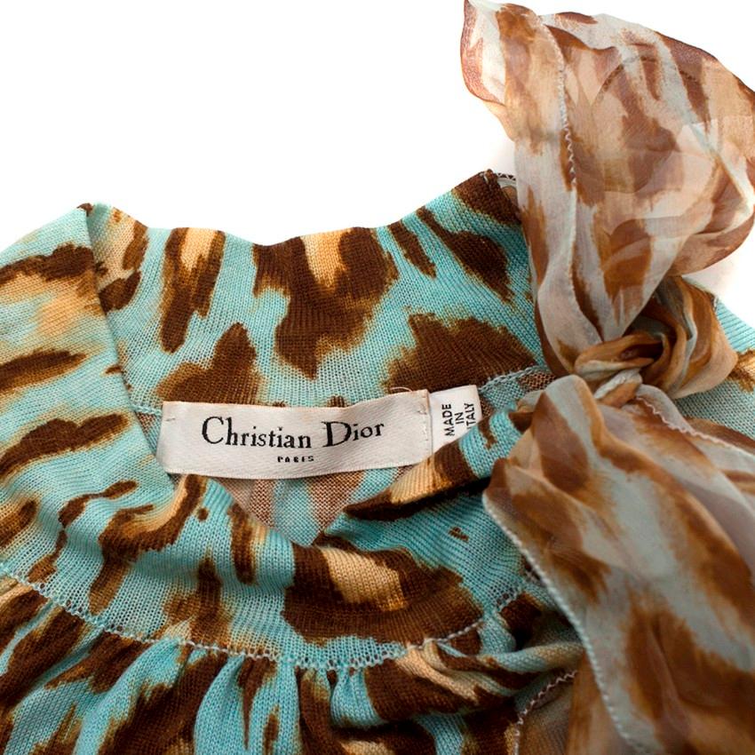 Christian Dior Blue Wool Blend Cheetah Print Top 

-Blue cheetah print, wool blend
-Long-sleeve
-High neckline
-100% silk decorative neck tie
-Ribbed neckline

Please note, these items are pre-owned and may show some signs of storage, even when