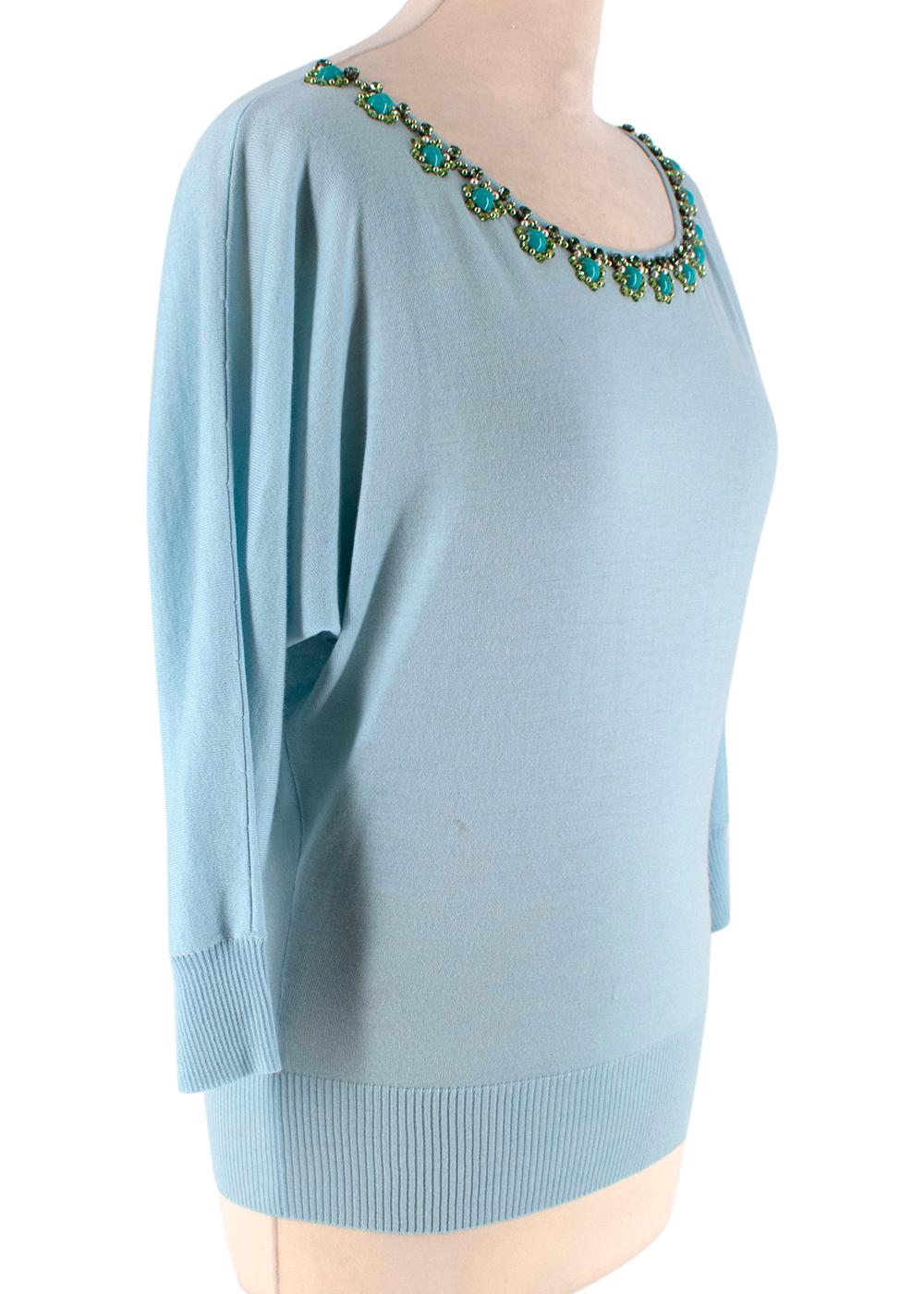 Christian Dior Blue Wool Beaded Knit Sweater

-Made of soft lightweight wool texture 
-Gorgeous green crystal and faux pearl embellishment to the neckline 
-Round neckline 
-Kimono style sleeves 
-Ribbed hems and cuffs 
-Classic timeless design