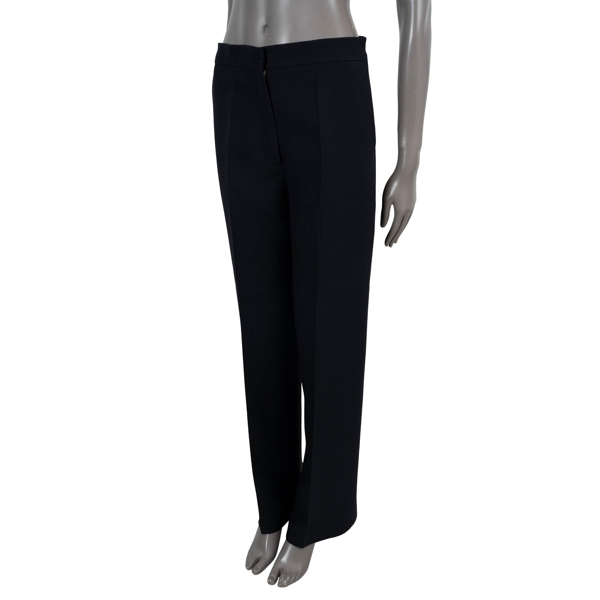 100% authentic Christian Dior straight-leg pants in midnight blue wool (77%) and silk (23%). Feature creases fronts and slant pockets. Closes with concealed hook and zipper and are unlined. Have been worn and are in excellent condition.