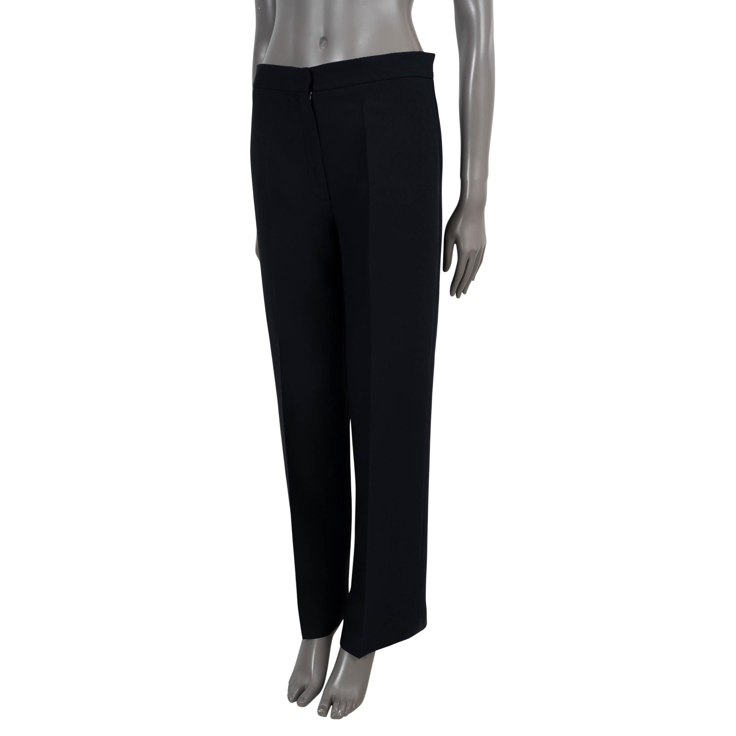 100% authentic Christian Dior straight-leg pants in midnight blue wool (77%) and silk (23%). Feature creases fronts and slant pockets. Closes with concealed hook and zipper and are unlined. Have been worn and are in excellent condition.