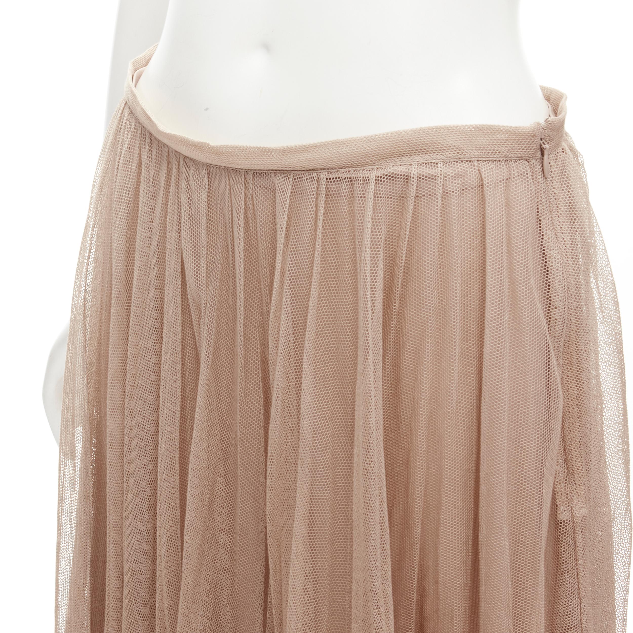 CHRISTIAN DIOR blush beige mesh pleated tulle layered skirt FR40 M
Brand: Christian Dior
Material: Silk
Color: Beige
Pattern: Solid
Closure: Zip
Extra Detail: Mesh pleated outer skirt. Fully lined in blush pink silk lining. Raw cut hem.
Made in: