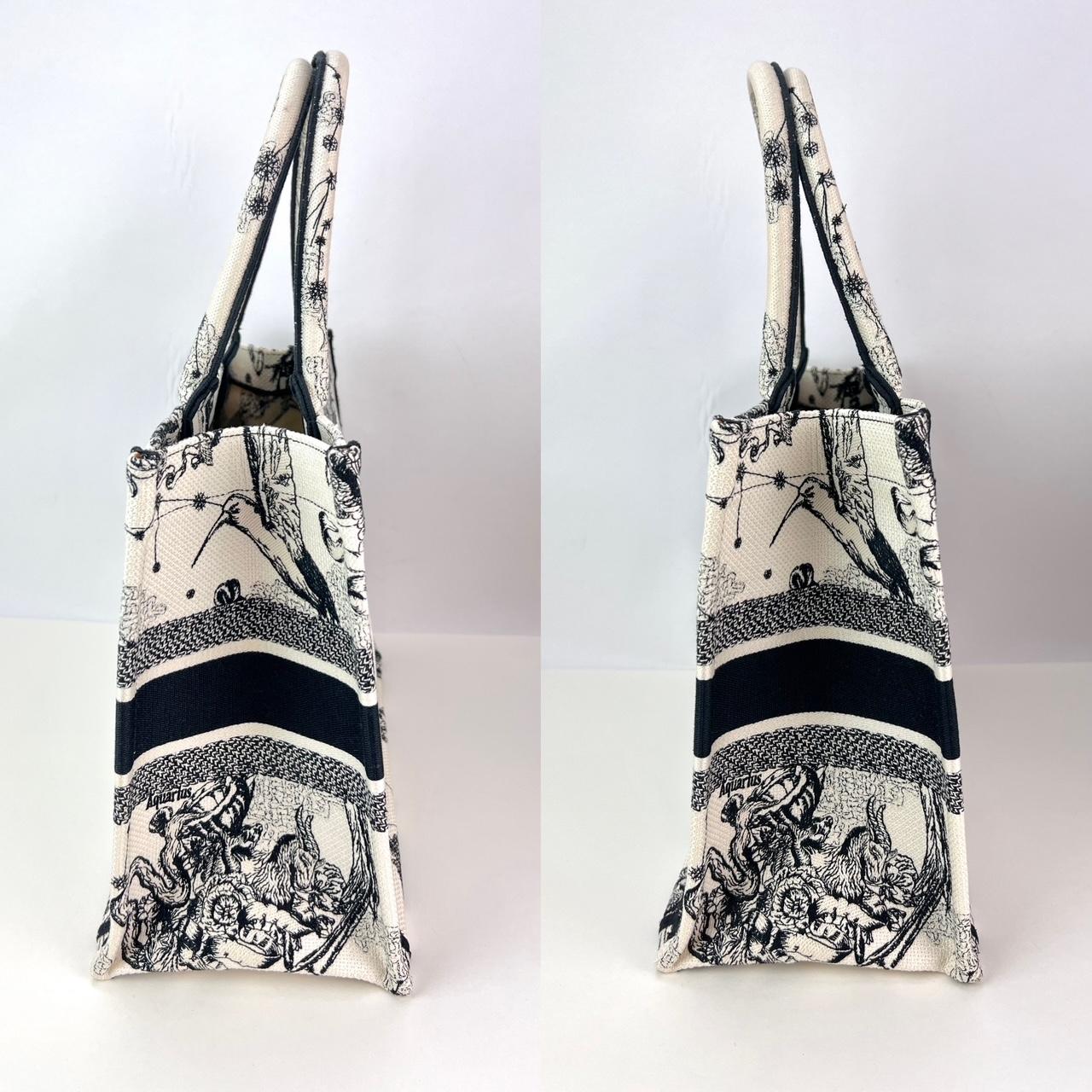 Pre-Owned  100% Authentic
Christian Dior Book Embroidered Canvas Medium Stars and Signs Black Tote
RATING: A...excellent, near mint, has little to no signs of wear
MATERIAL: Canvas Embroidered Medium Dioriviera Toile
HANDLE: double embroidered