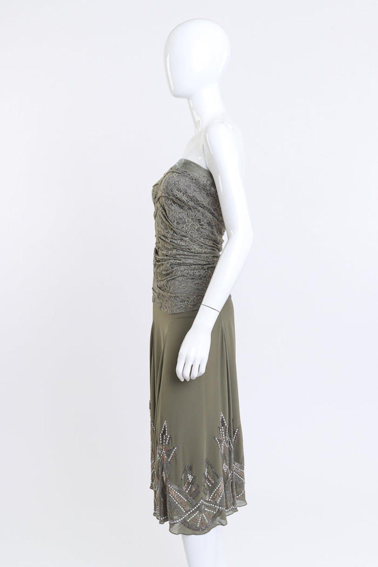 CHRISTIAN DIOR BOUTIQUE ART DECO BEADED OLIVE GREEN LACE/MESH DRESS (US 4)

This Christian Dior Boutique strapless mermaid dress is from the early 2000s and features a ruched floral net lace bodice with a low drop waist. The strapless design is