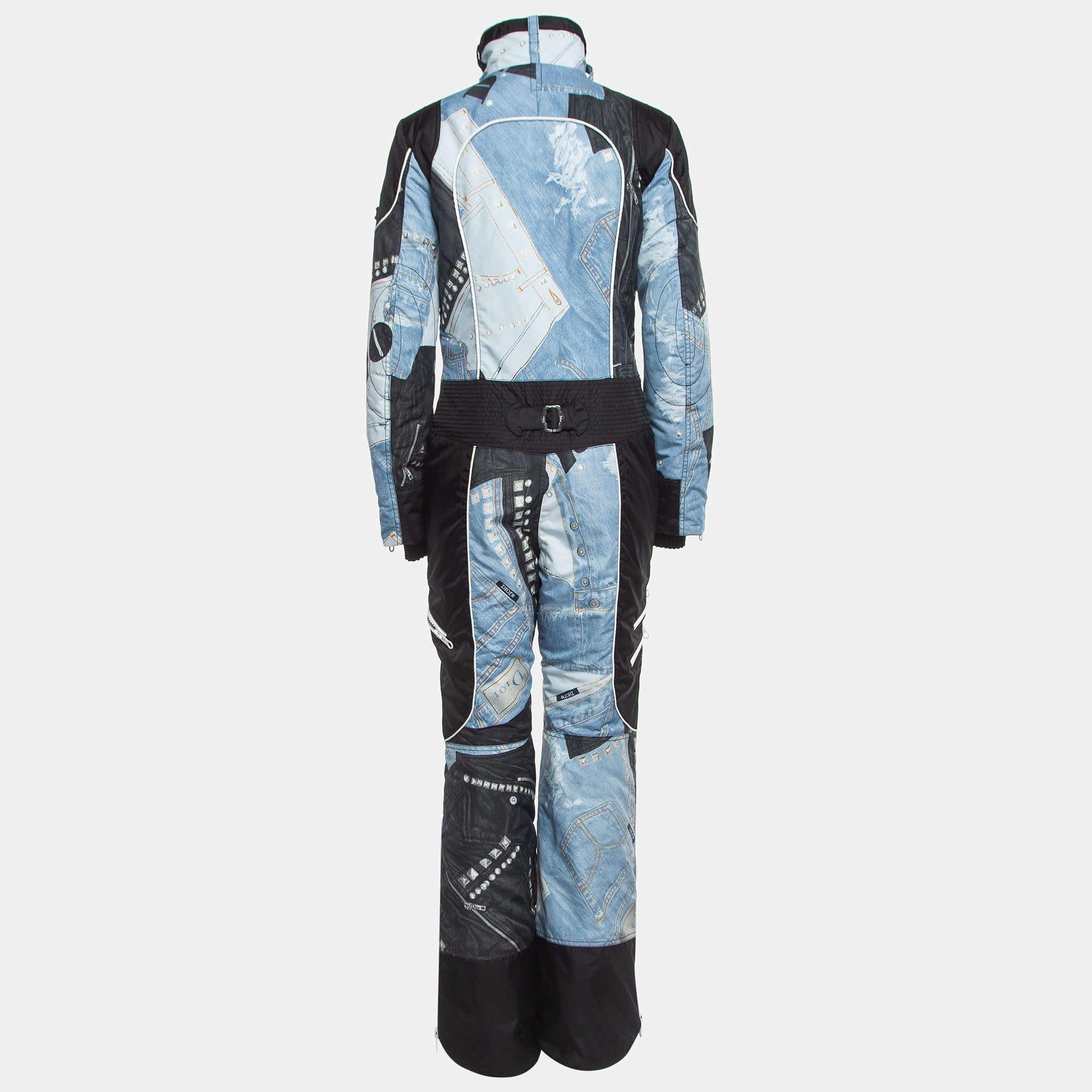 The Christian Dior Boutique ski suit is a luxurious winter essential. Crafted with precision, it features a sleek black & blue design, offering both style and functionality. All its components provide versatility, ensuring comfort and elegance on