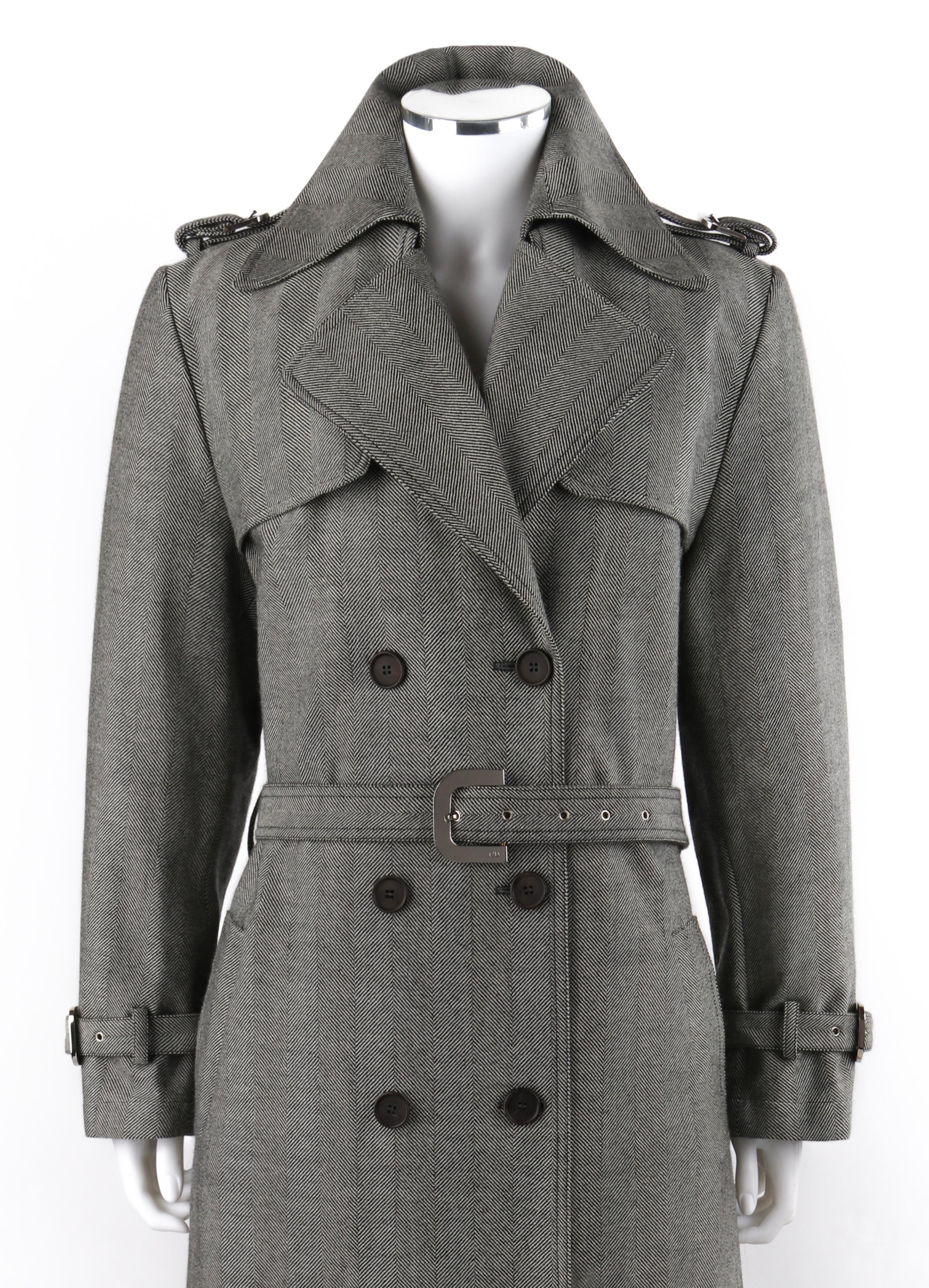 CHRISTIAN DIOR Boutique c.2000’s Herringbone Double Breasted Belted Trench Coat
 
Brand / Manufacturer: Christian Dior
Circa: 2000’s
Style: Belted trench coat
Color(s): Gray and white
Lined: Yes
Marked Fabric Content: “76% Wool, 24%