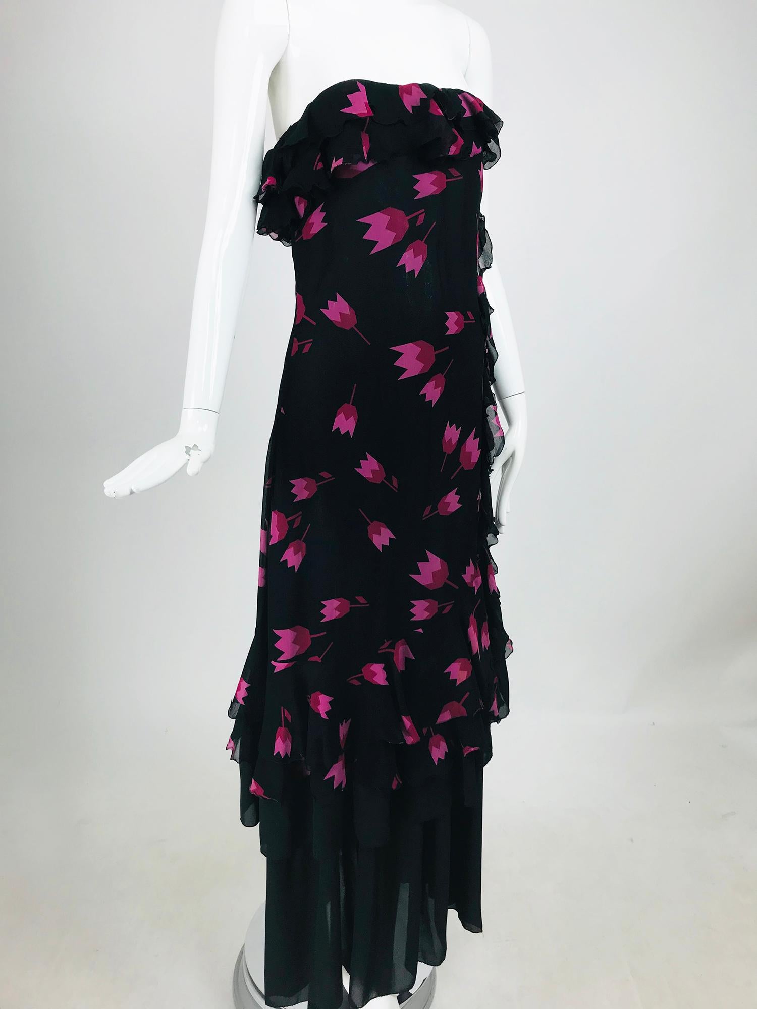 Christian Dior Boutique Tulip print Strapless layered  Maxi Dress from the 1970s during Marc Bohans design tenure at Dior. The Art Deco stylized tulips in the print of the over dress really pop against the black ground making this dress a real stand