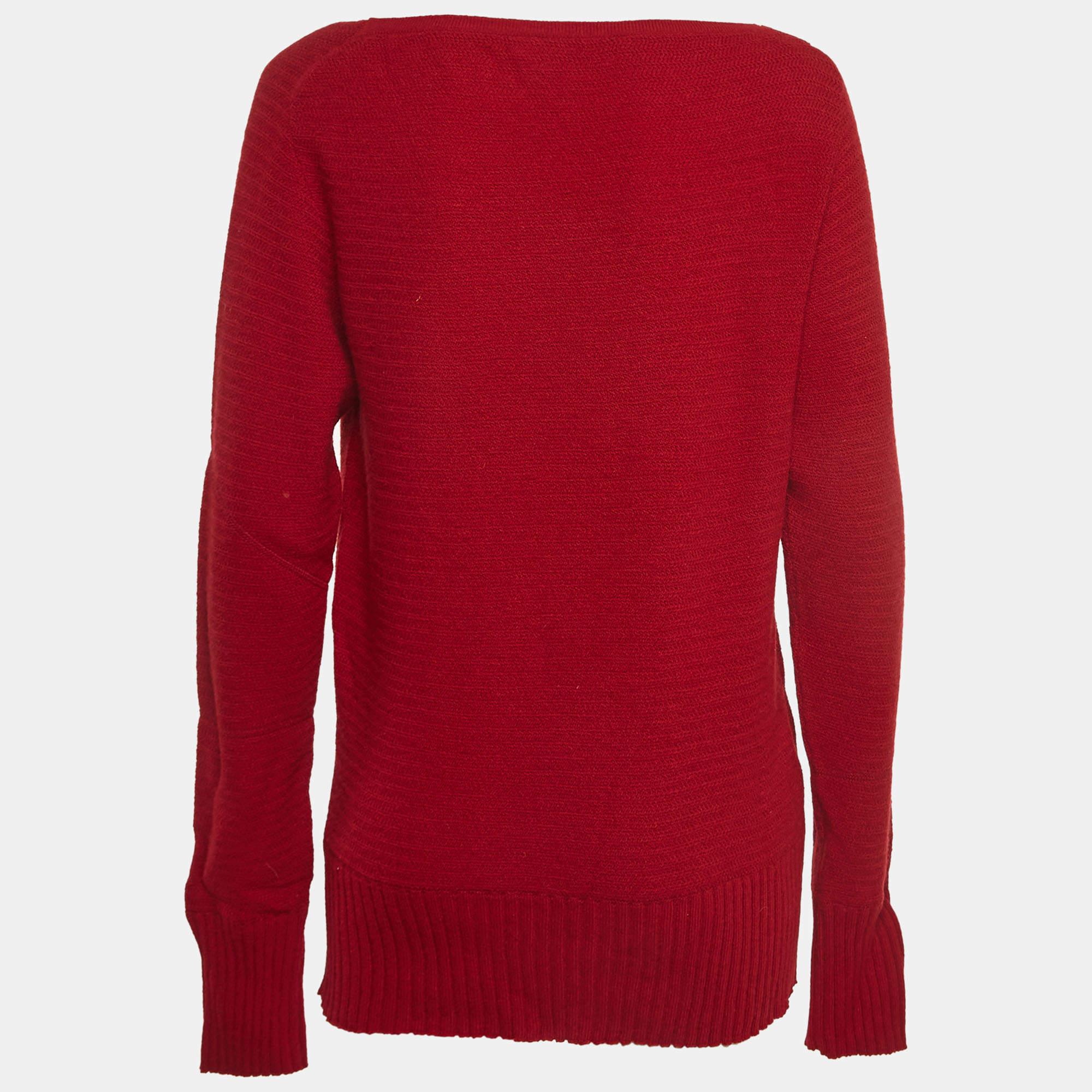The Christian Dior Boutique sweater is a luxurious fashion statement, marrying comfort and style. Crafted with precision, the vibrant red hue complements the cozy wool blend. The intricate knit showcases Dior's timeless elegance, making it a