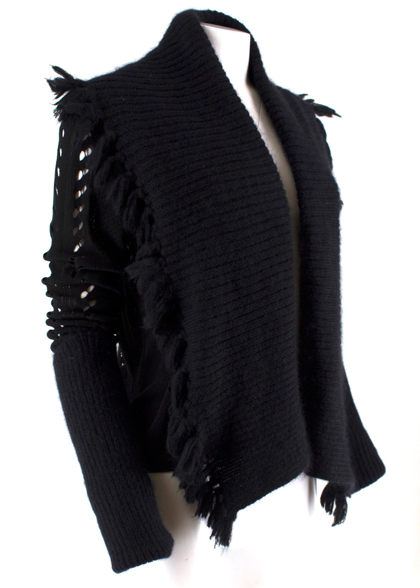 Christian Dior Boutique Vintage Black Cut Out Cardigan

-Black cardigan with cut out detailing
-Wool trim on cuffs and collar
-Tasseled collar
-Oversized sleeves
- Cotton and mohair blend

Please note, these items are pre-owned and may show signs of