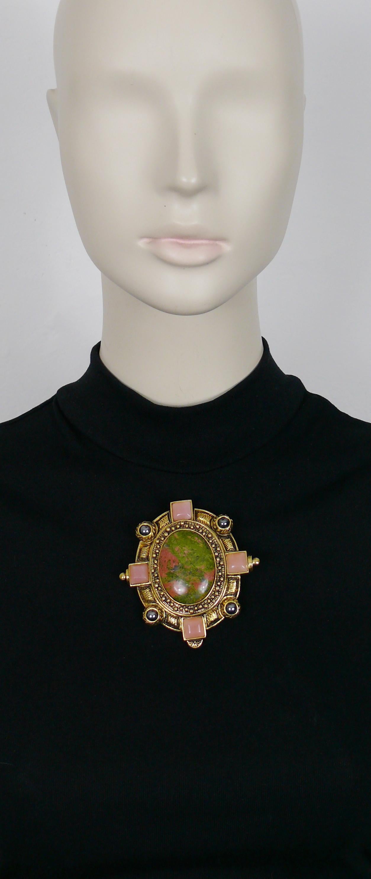 CHRISTIAN DIOR BOUTIQUE vintage massive antiqued gold toned brooch embellished with a large oval hard stone cabochon (marbled green and pink colours), hematite colour beads and square baby pink glass cabochons.

Could be worn as a brooch or