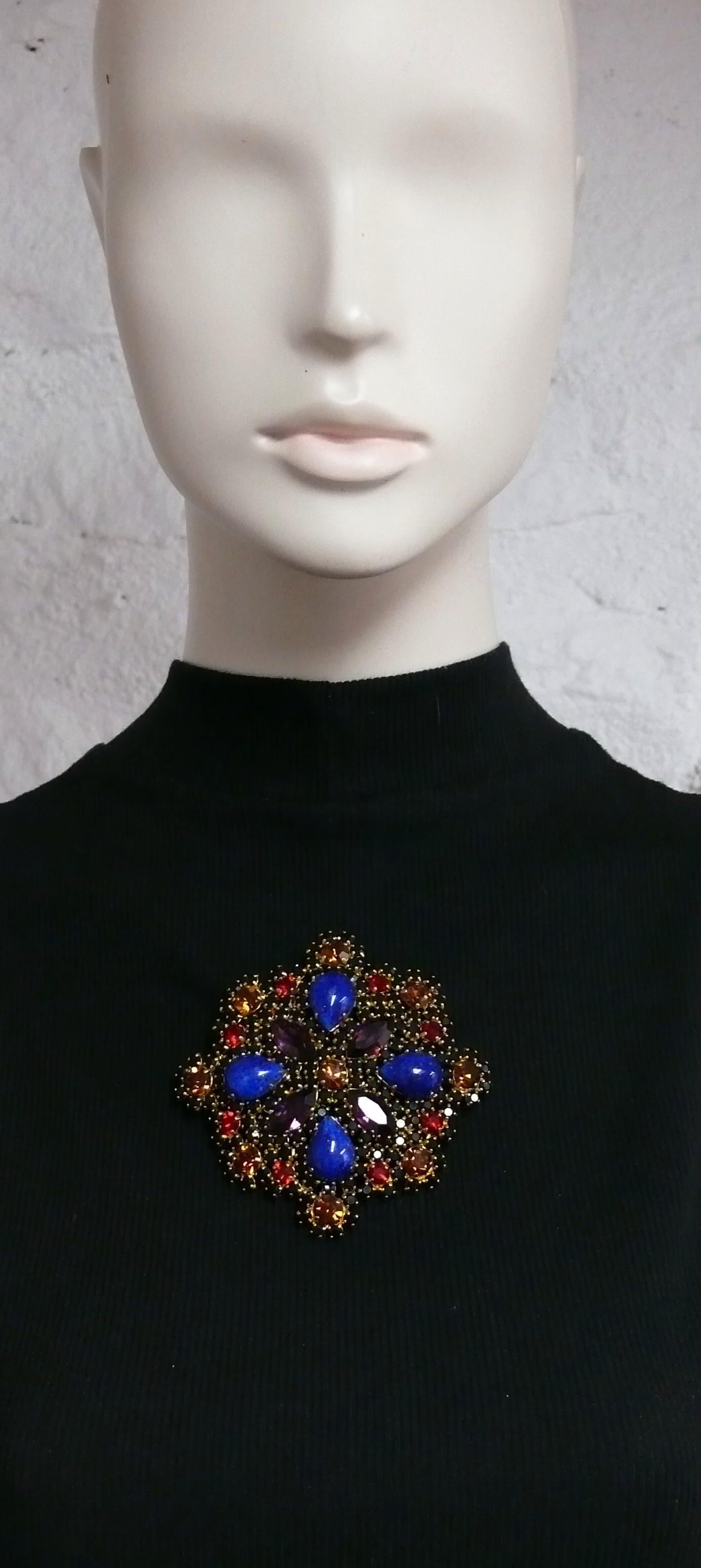 CHRISTIAN DIOR vintage massive gold toned brooch embellished with multicolored crystals (color shades : jet black, ruby red, topaz and amethyst) and faux lapis lazuli glass pear cabochons.

Can be worn as a pendant or brooch.

Marked CHRISTIAN DIOR