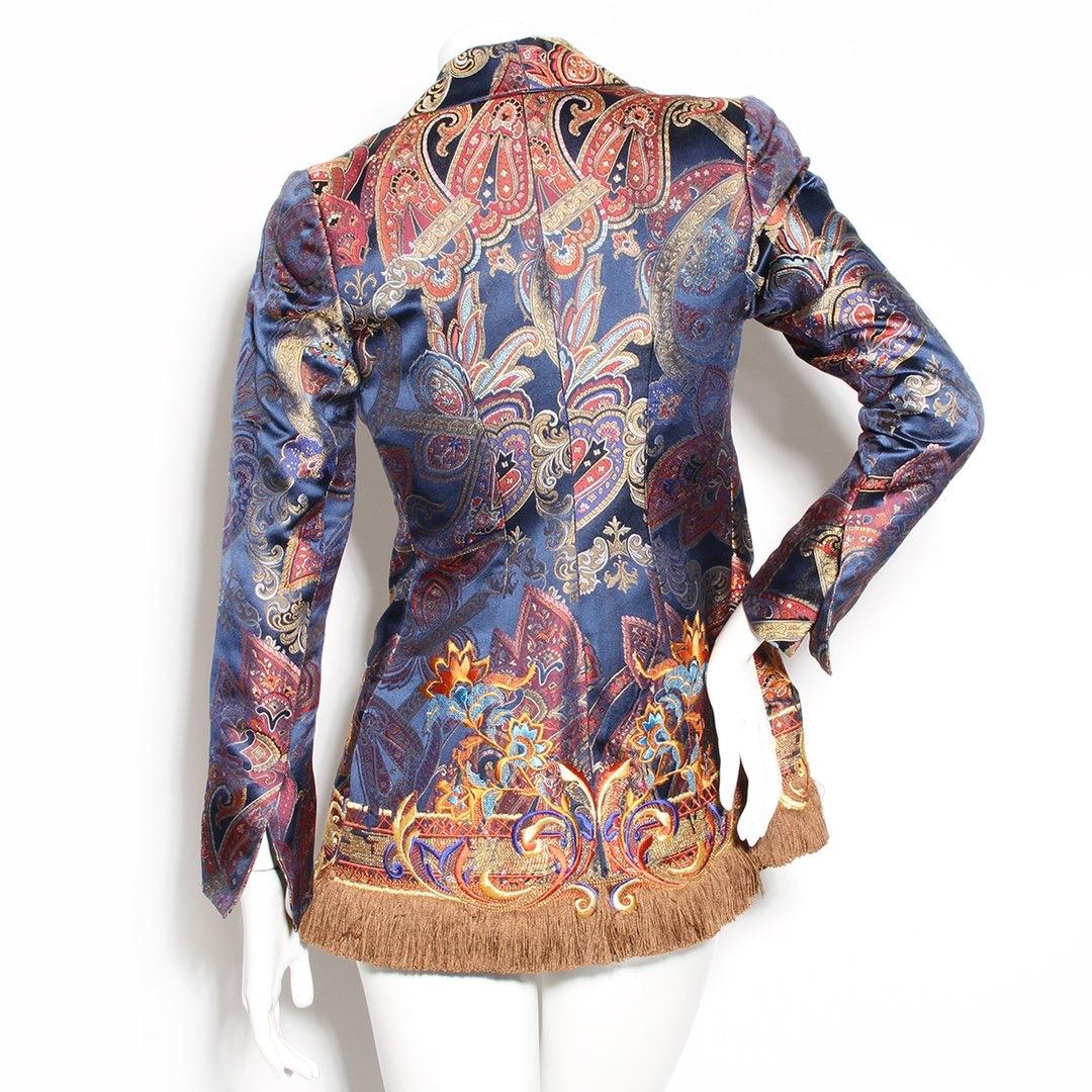 Brocade jacket by Gianfranco Ferre for Christian Dior
Circa 1990's
Multicolor design 
Paisley like pattern 
Snap front closure 
Fringe hem 
Notched collar 
Decorative front brooch 
Made in France
Condition: Excellent, little to no visible wear. (see