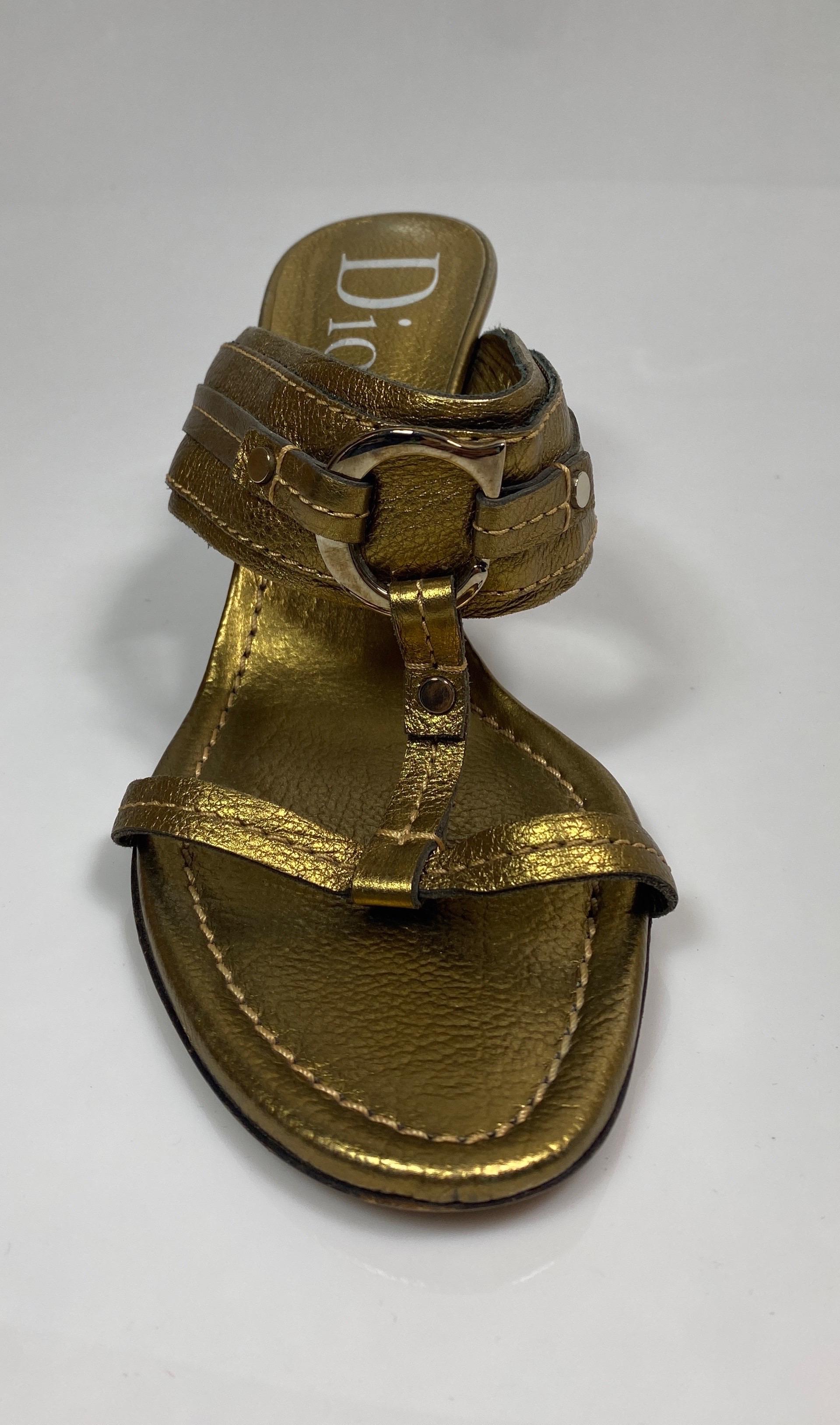 Christian Dior Bronze Leather Sandal -Size 38 
3” high heel
.25” thin strap across toe box with T strap 
2” wide top band connected by the T strap 
Silver C on right shoe and D on the left
Excellent condition