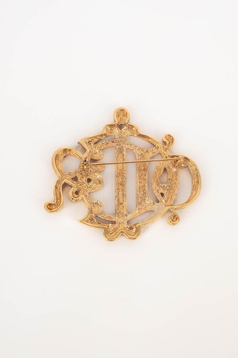 Dior - Golden metal brooch.

Additional information:
Condition: Very good condition
Dimensions: Height: 5.5 cm

Seller Reference: BR9