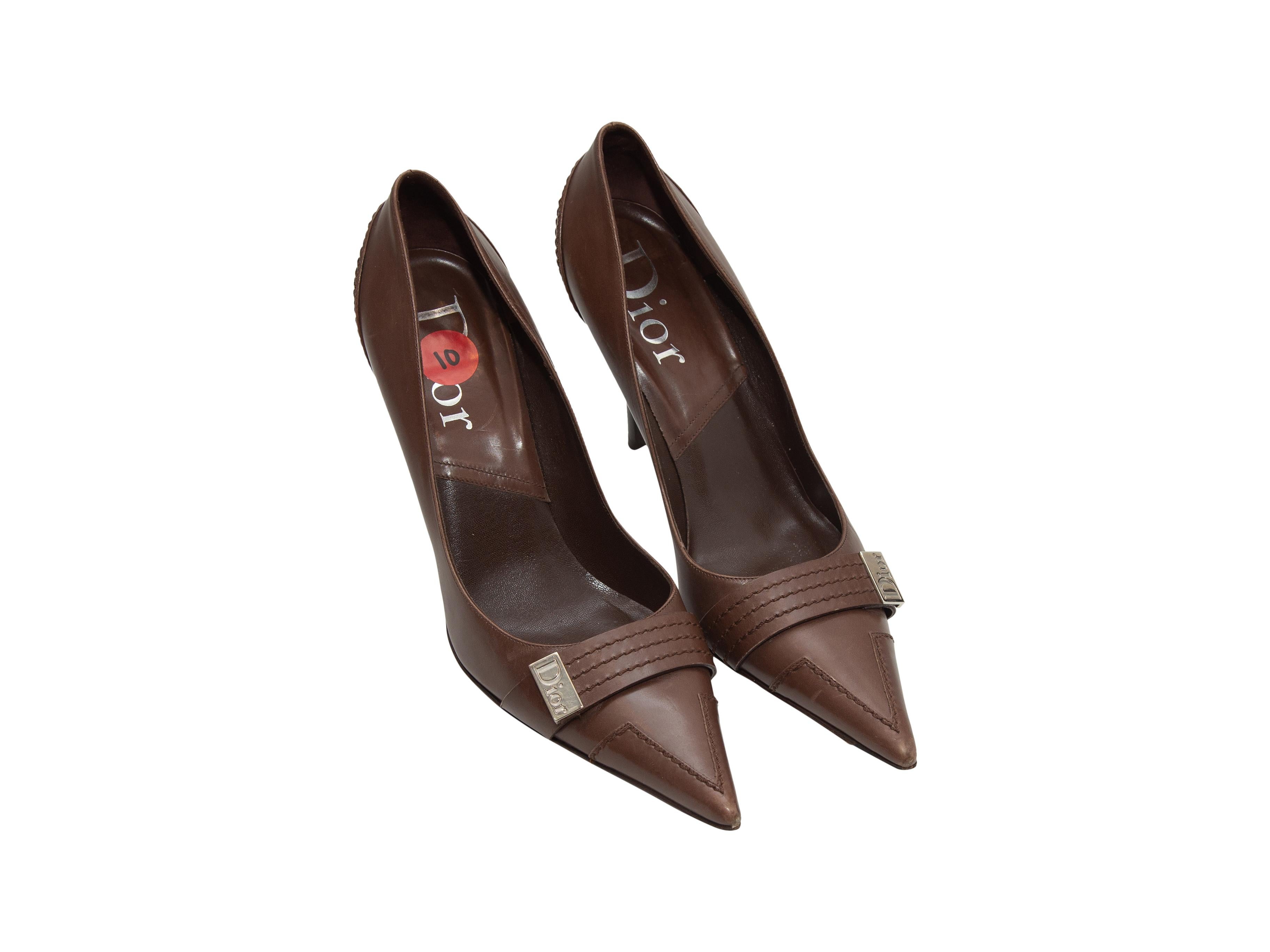 Product details: Brown leather pointed-toe pumps by Christian Dior. Silver-tone buckle accents at toes. Designer size 40. 4