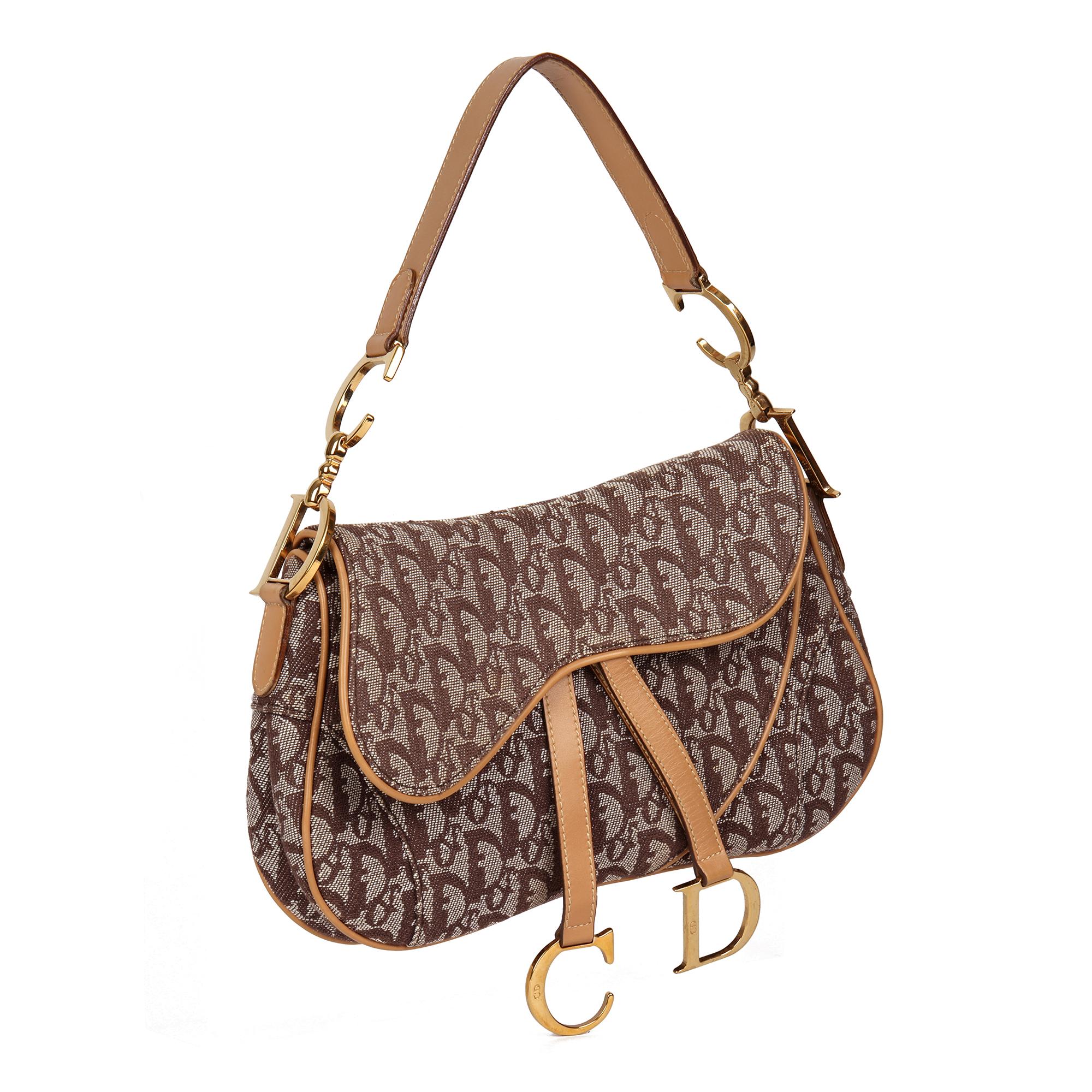 CHRISTIAN DIOR
Brown Monogram Canvas & Calfskin Leather Vintage Double Saddle Bag

Serial Number: RU 1011
Age (Circa): 2001
Authenticity Details: Date Stamp (Made in Italy)
Gender: Ladies
Type: Shoulder, Top Handle

Colour: Brown
Hardware:
