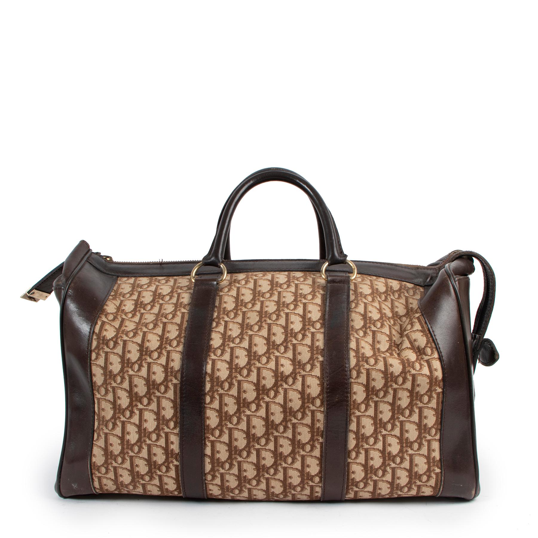 Christian Dior Brown Oblique Monogram Vintage Travel Bag

This Dior duffle travel bag is distinguished by a functional and elegant design. The beige and brown Dior Oblique jacquard canvas is enhanced by details in brown smooth calfskin and the CD