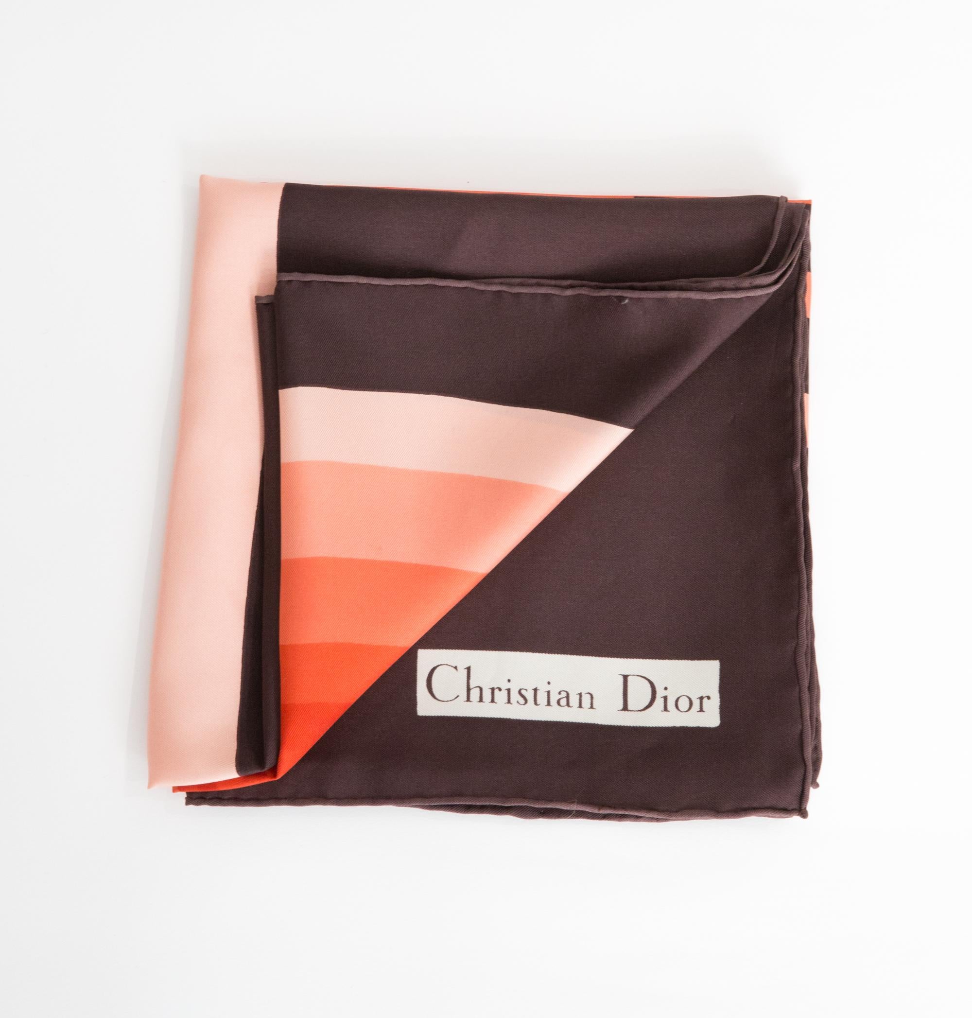 Christian Dior brown Silk Scarf featuring a large “D” print, and a Christian Dior signature. 
Circa 1970s
In good vintage condition. Made in France.
30.7in (78cm)  X 30.7in (78cm)
We guarantee you will receive this  iconic item as described and