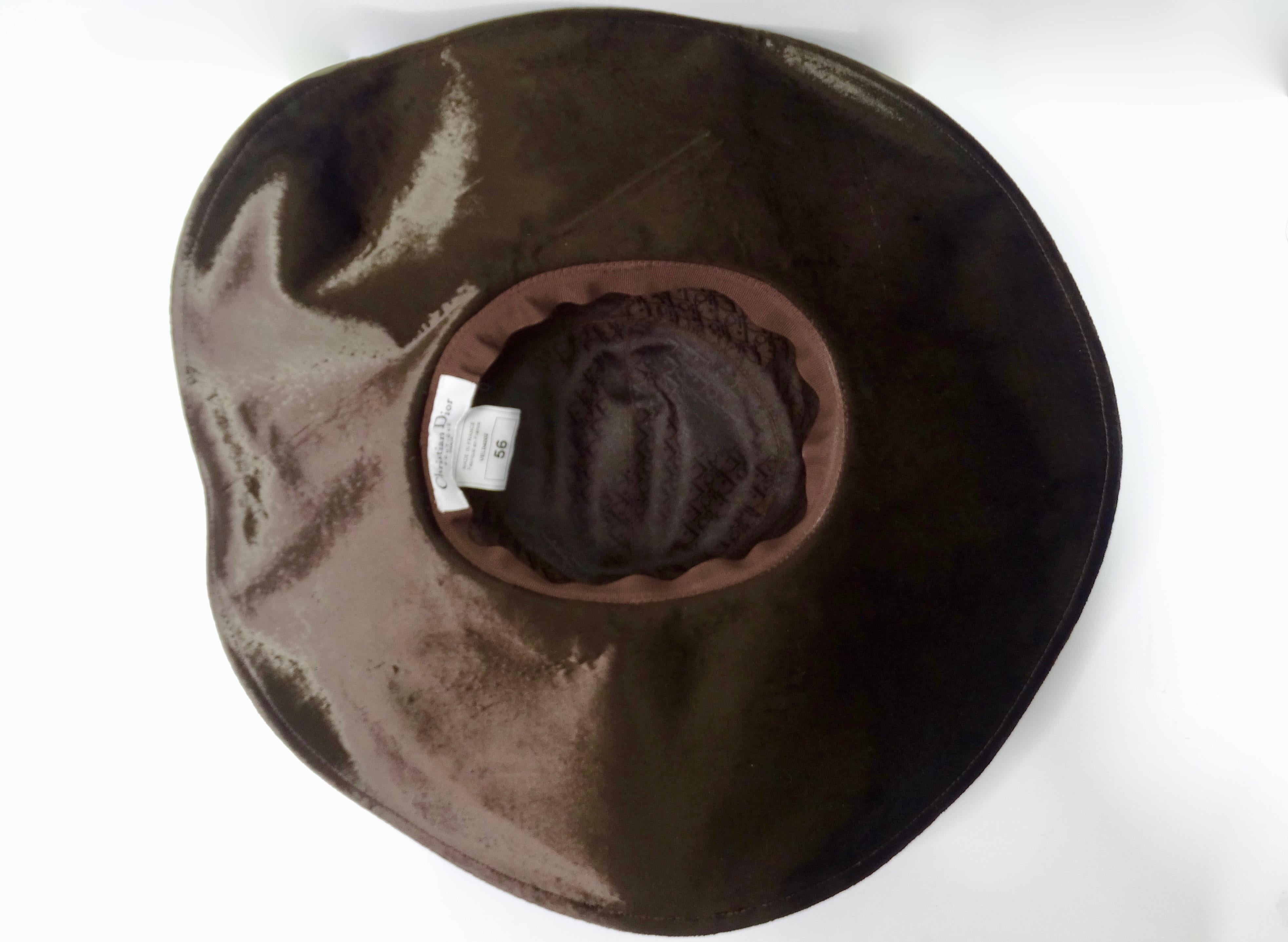 Too a-dior-able! Created in the 1990s with a 70s style (most likely from the Galliano era), this Dior sun hat is crafted from chocolate brown viscose velvet and features a wide floppy brim with a wire trim for a structured look. Interior is lined