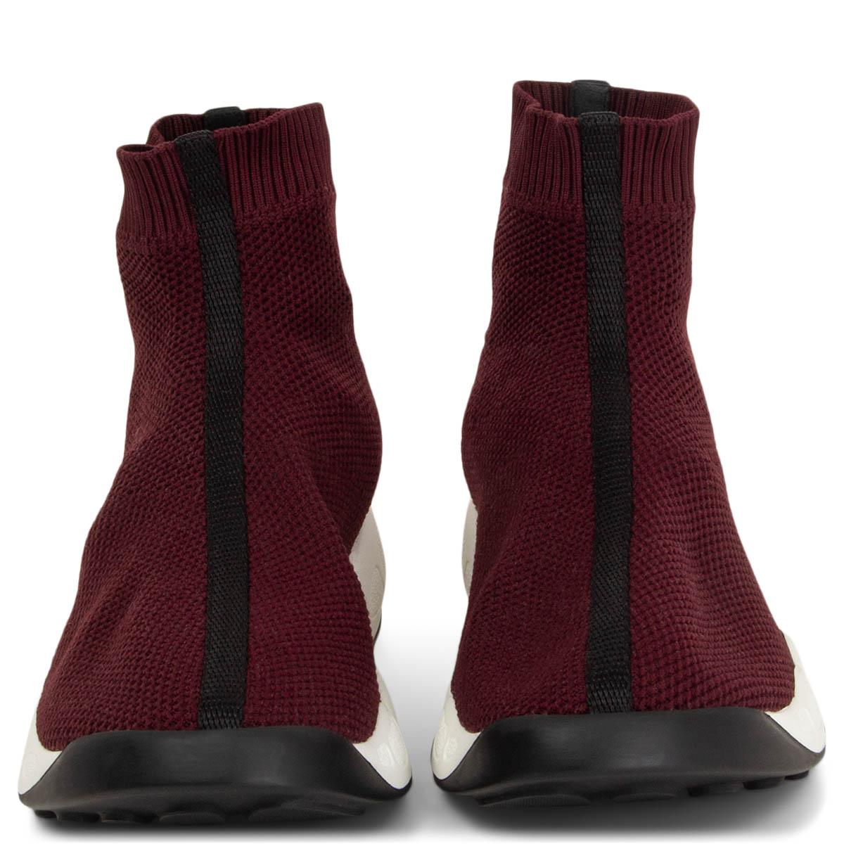 100% authentic Christian Dior Fusion Technical high top sneakers in burgundy mesh featuring a logo printed pull tab at rear and white rubber soles. Brand new. Comes with dust bags. 

Measurements
Imprinted Size	Missing Size 
Shoe Size	estimated