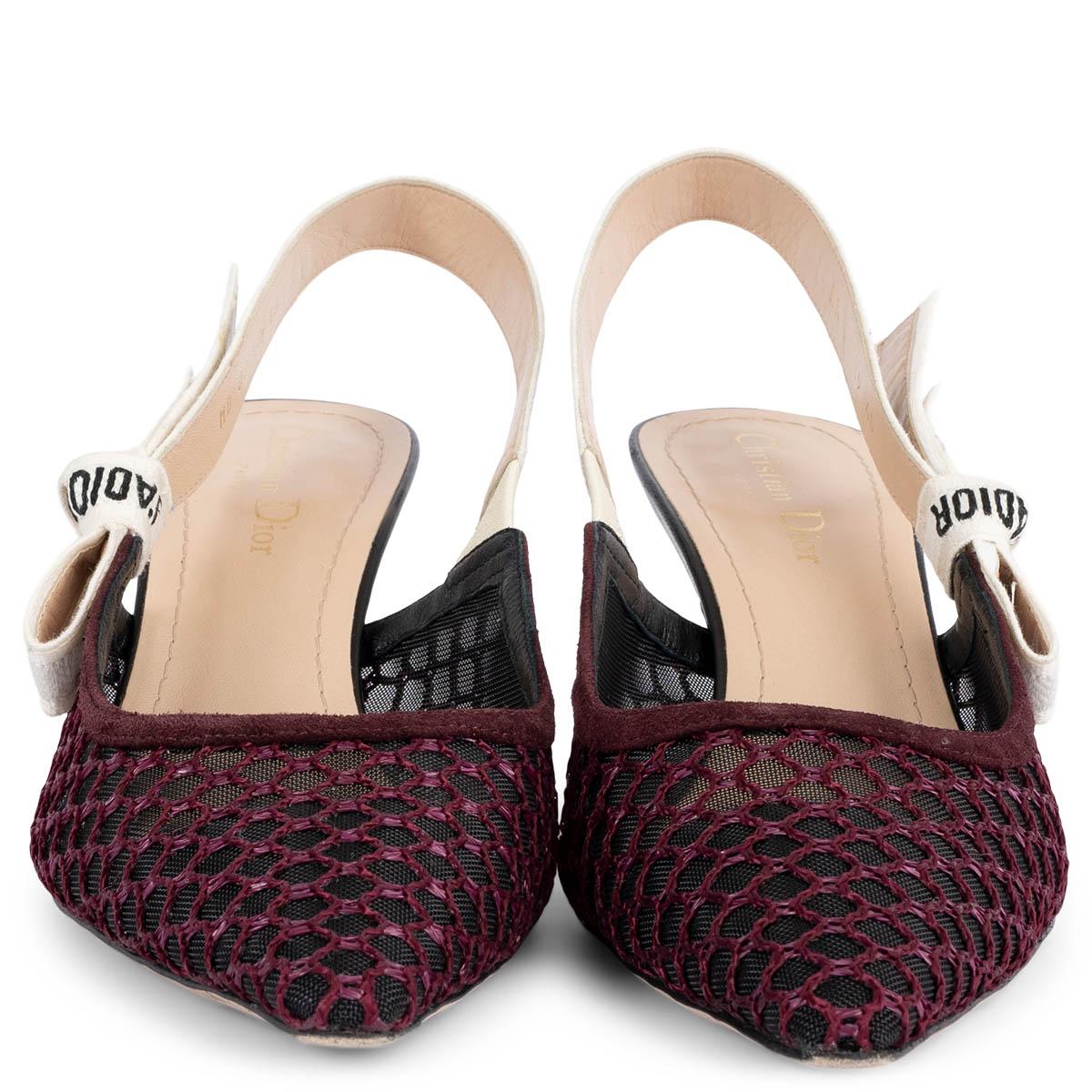 100% authentic Christian Dior J'Adior slingback pumps crafted in black and burgundy mesh and suede. The off-white two-tone embroidered 'J'ADIOR' ribbon is embellished with a flat bow. Have been worn and are in excellent condition.