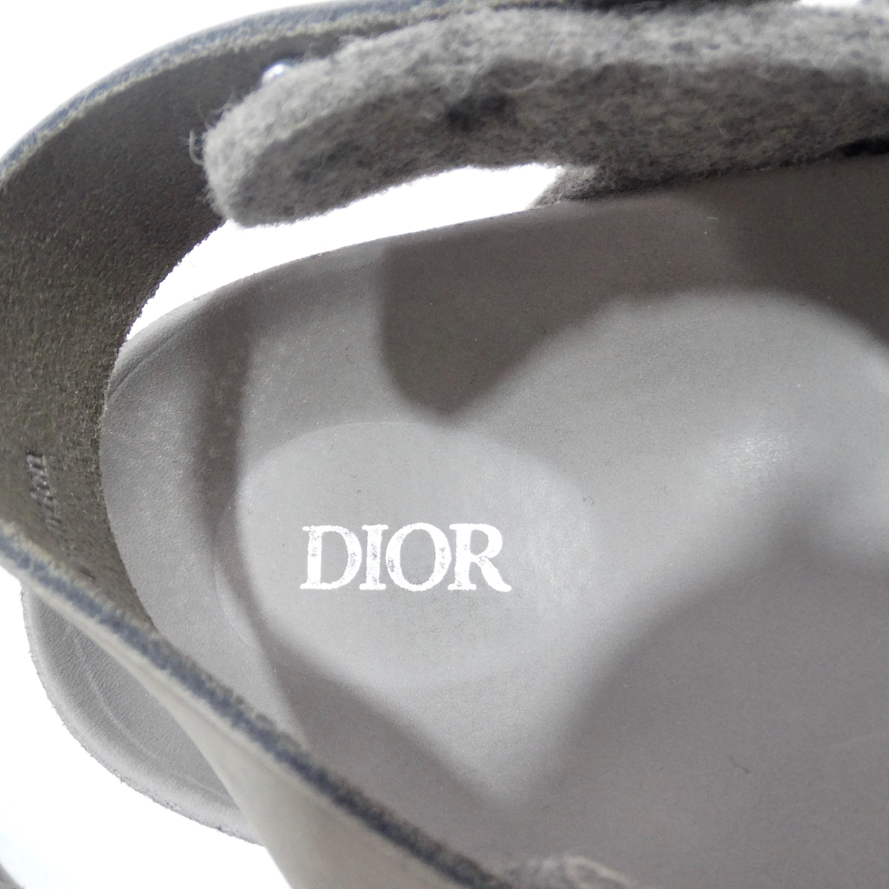 Introducing the Christian Dior By Birkenstock Milano Sandal in Grey – a groundbreaking collaboration that merges the iconic Dior aesthetic with the renowned craftsmanship of Birkenstock. This is not just a sandal; it's a testament to exceptional