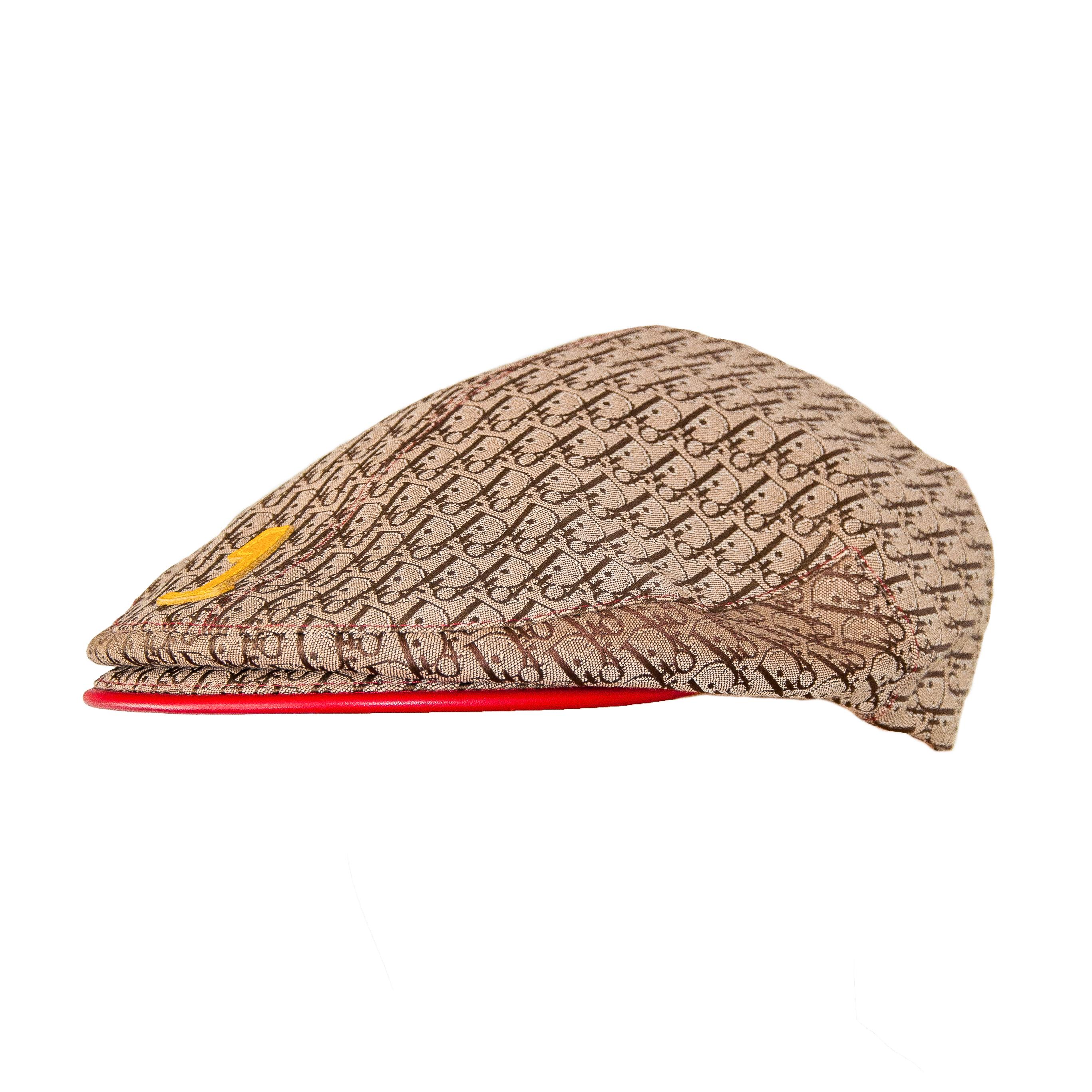 Ruder Than The Rest presents: Christian Dior by Galliano 2004 Rasta collection flat cap.

A favourite accessory of designer John Galliano.

Brown Diorissimo monogram fabric wih red, gold and green leather accents.

Red, gold and green woven fabric