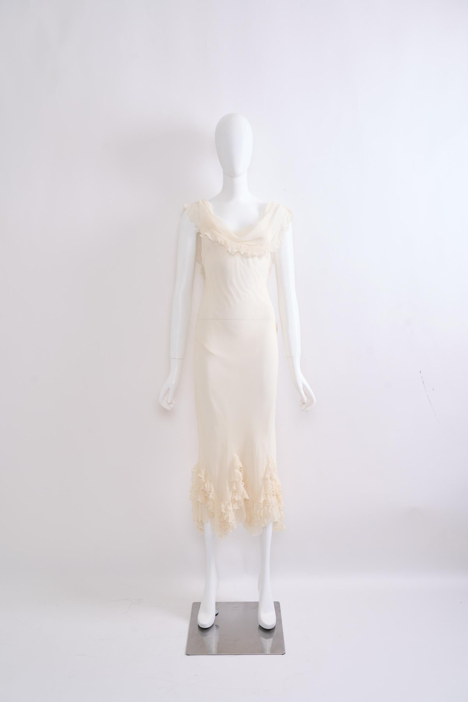 Experience the iconic craftsmanship of John Galliano at Dior with this ethereal silk ruffle dress from the Spring/Summer 2006 collection. This delicate, ruffled silk dress features a plunging neckline, exuding effortless elegance. The hemline is
